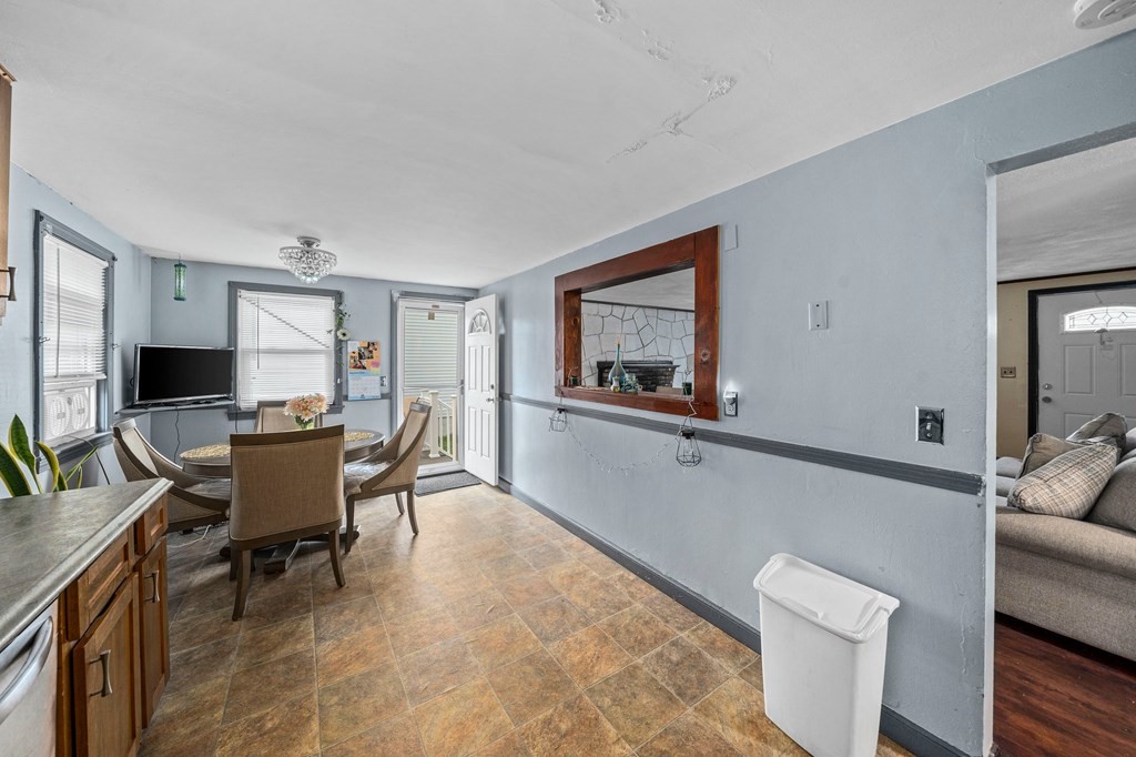 65 Wyvern Street Boston, MA 02131 - Photo 7 of 26 a living room with furniture and a flat screen tv