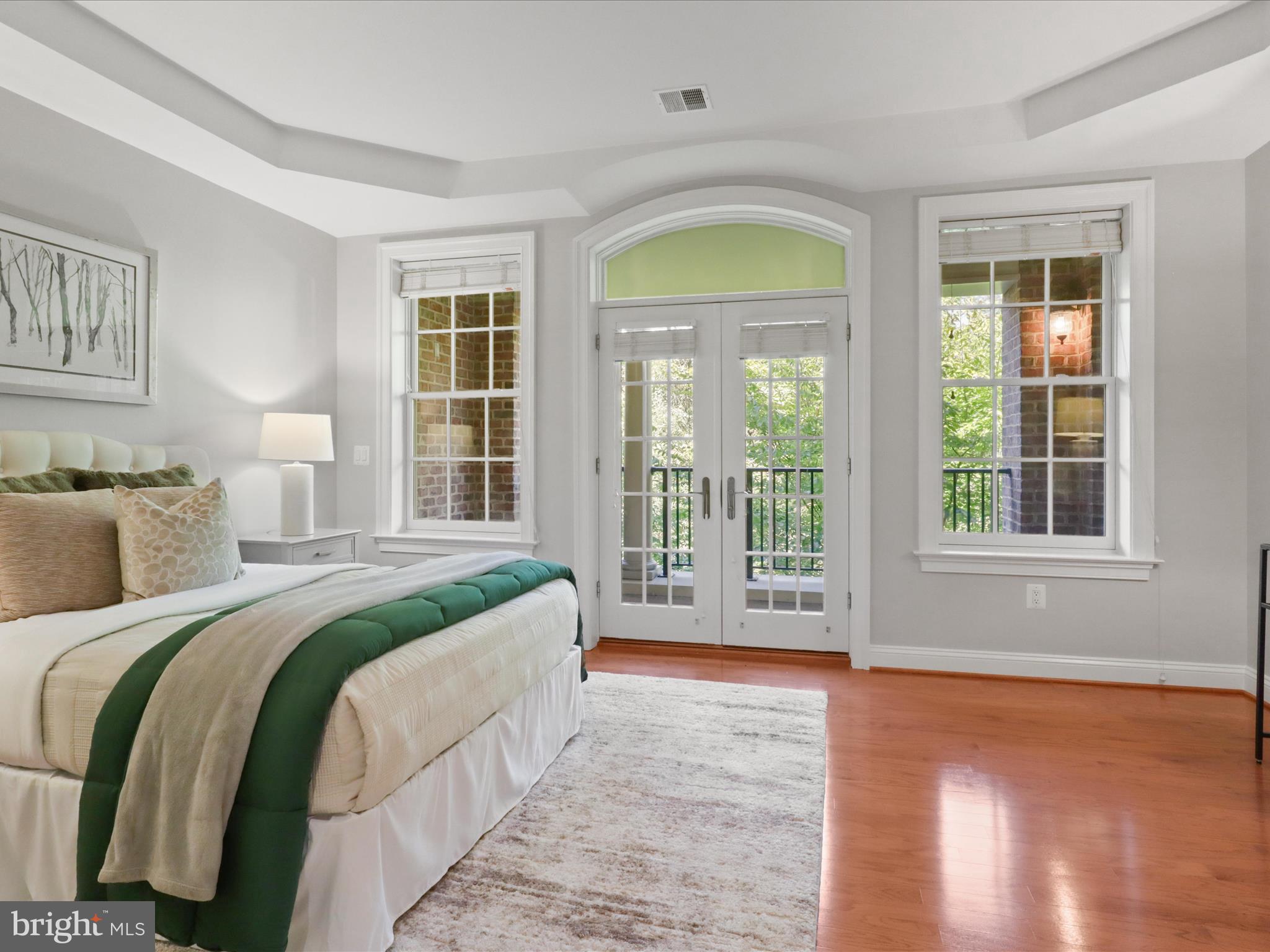 1781 Chain Bridge Road, Unit 303 McLean, VA 22102 - Photo 15 of 56 a spacious bedroom with a bed and a large window