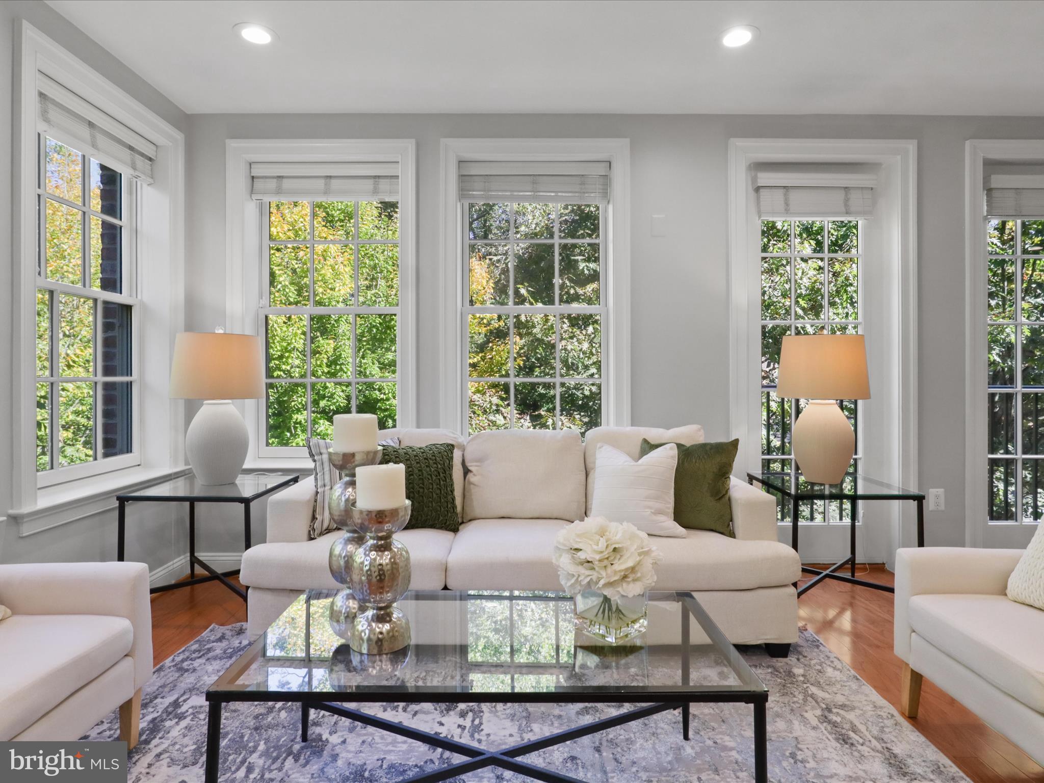 1781 Chain Bridge Road, Unit 303 McLean, VA 22102 - Photo 32 of 56 a living room with furniture and a large window