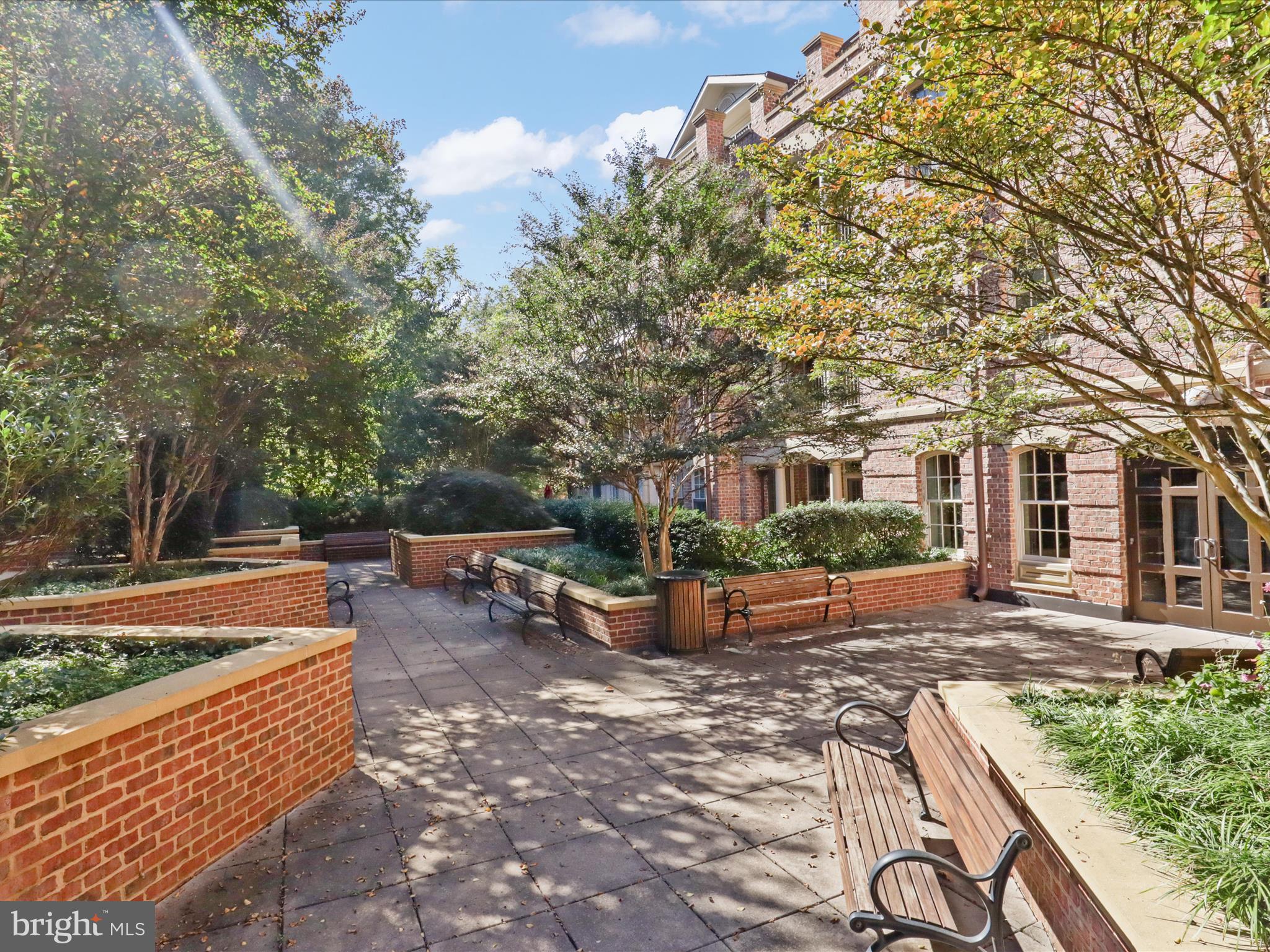 1781 Chain Bridge Road, Unit 303 McLean, VA 22102 - Photo 50 of 56 a front view of a house with garden
