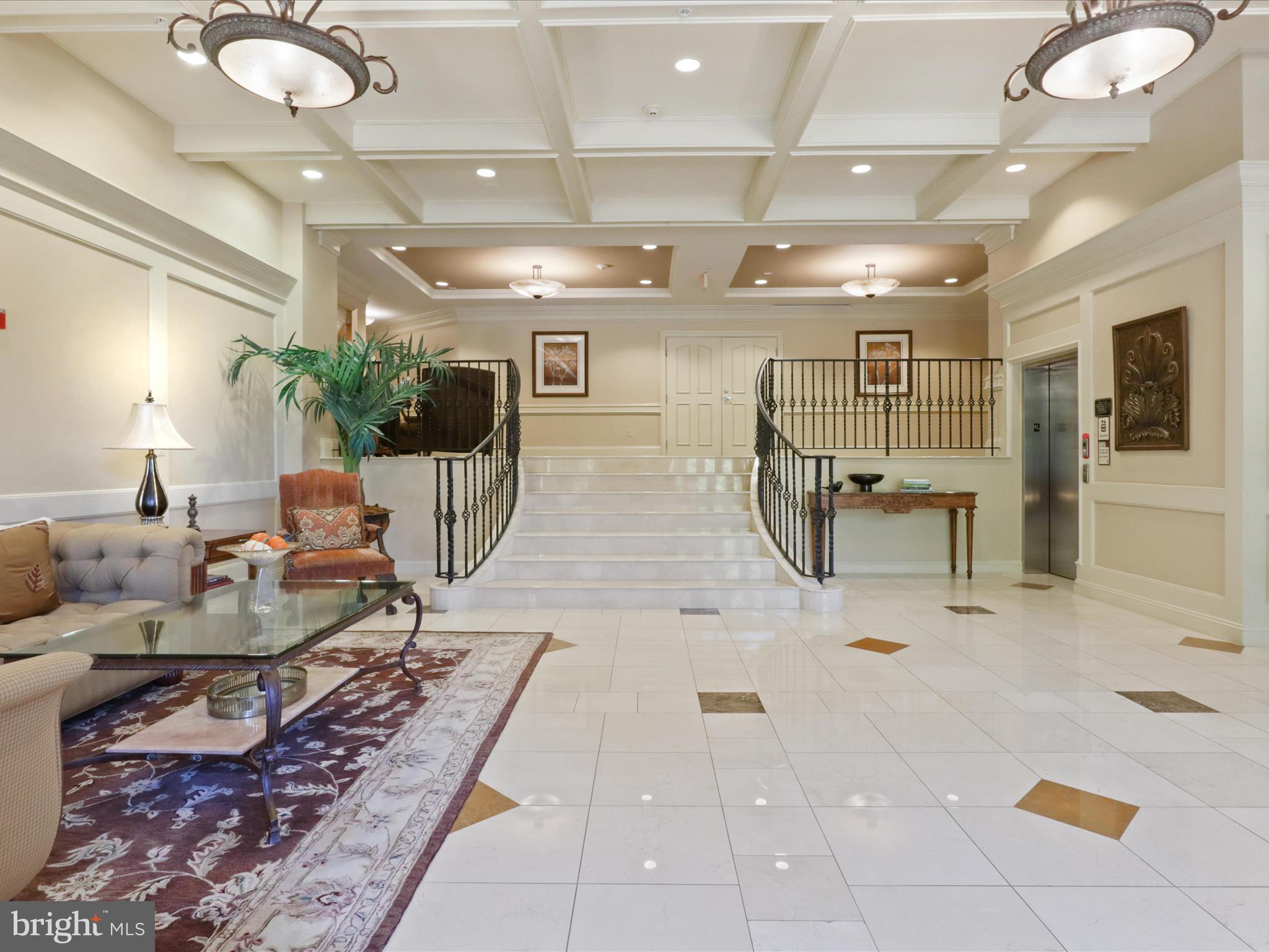 1781 Chain Bridge Road, Unit 303 McLean, VA 22102 - Photo 5 of 56 a living room with furniture and a chandelier