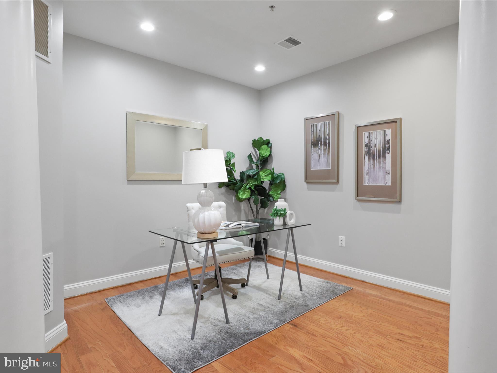 1781 Chain Bridge Road, Unit 303 McLean, VA 22102 - Photo 9 of 56 a workspace with furniture and wooden floor