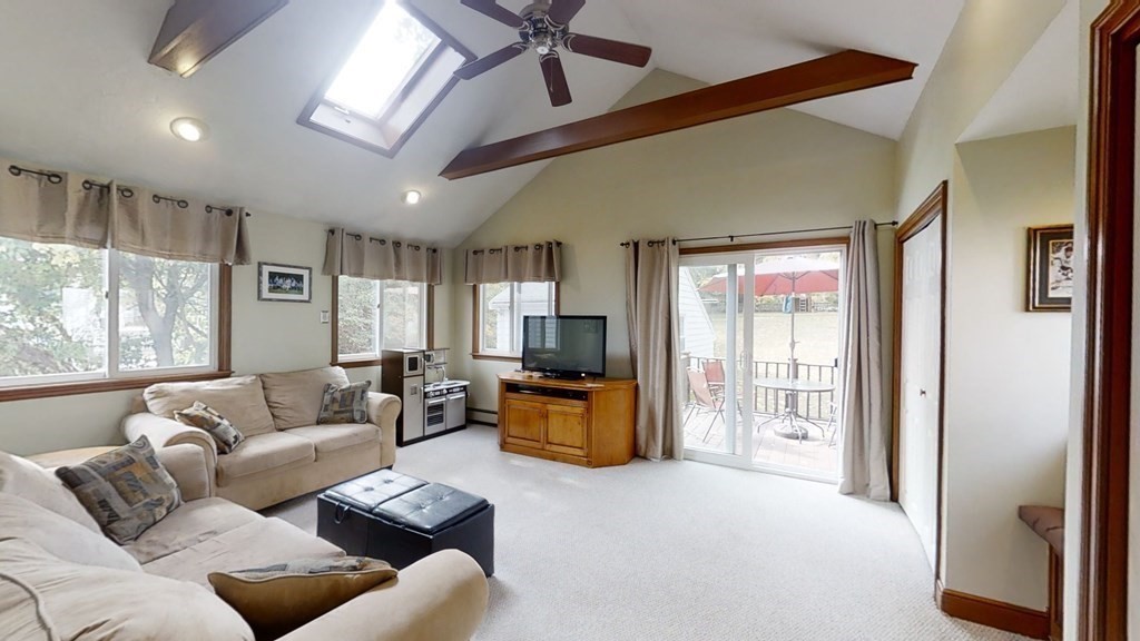 17 Oakcrest Road Needham, MA 02492 - Photo 13 of 31 a living room with furniture flat screen tv and windows