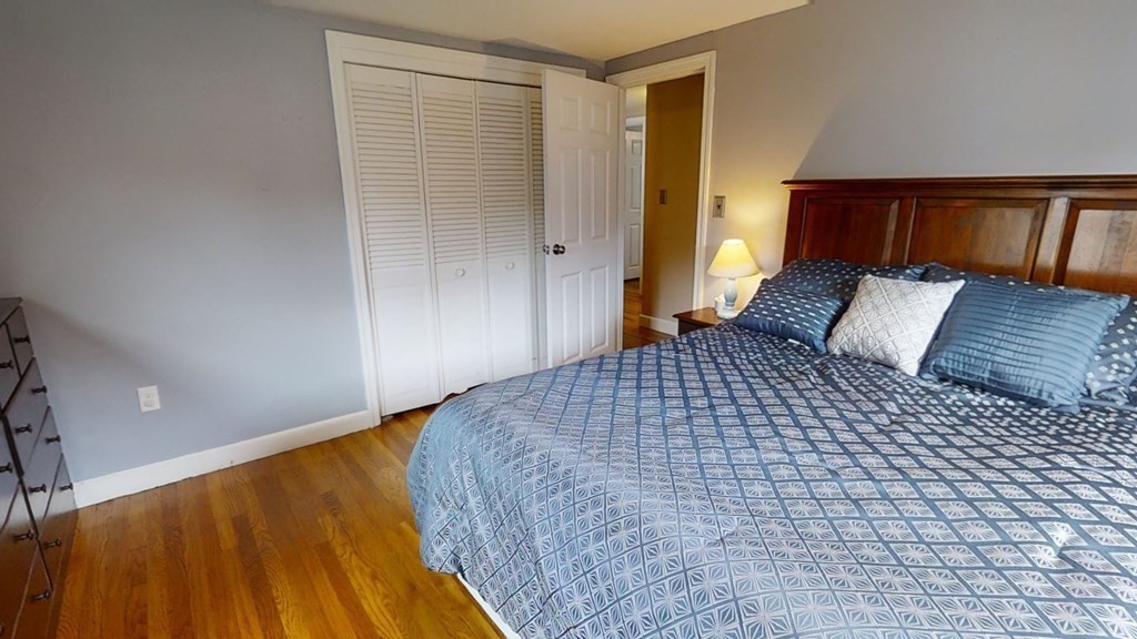 17 Oakcrest Road Needham, MA 02492 - Photo 19 of 31 a bedroom with a bed and a night stand