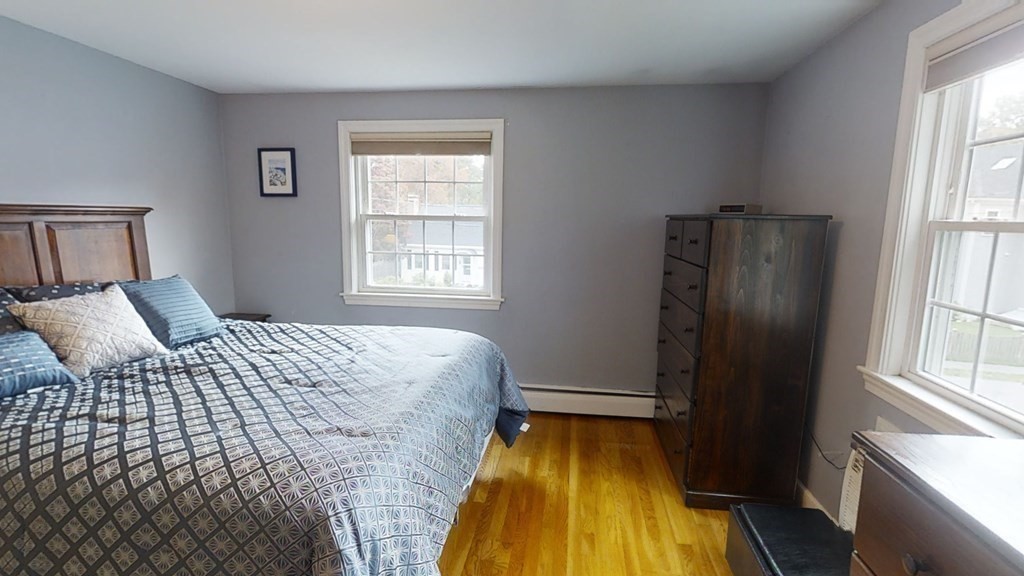 17 Oakcrest Road Needham, MA 02492 - Photo 20 of 31 a bedroom with a bed and wooden floor