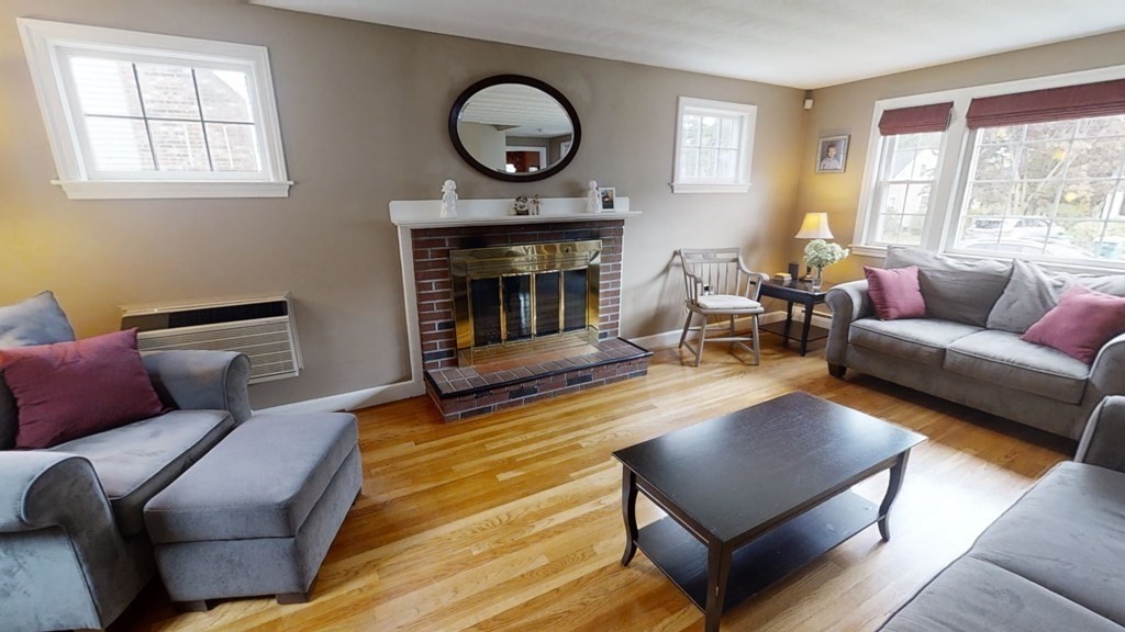 17 Oakcrest Road Needham, MA 02492 - Photo 5 of 31 a living room with furniture and a fireplace