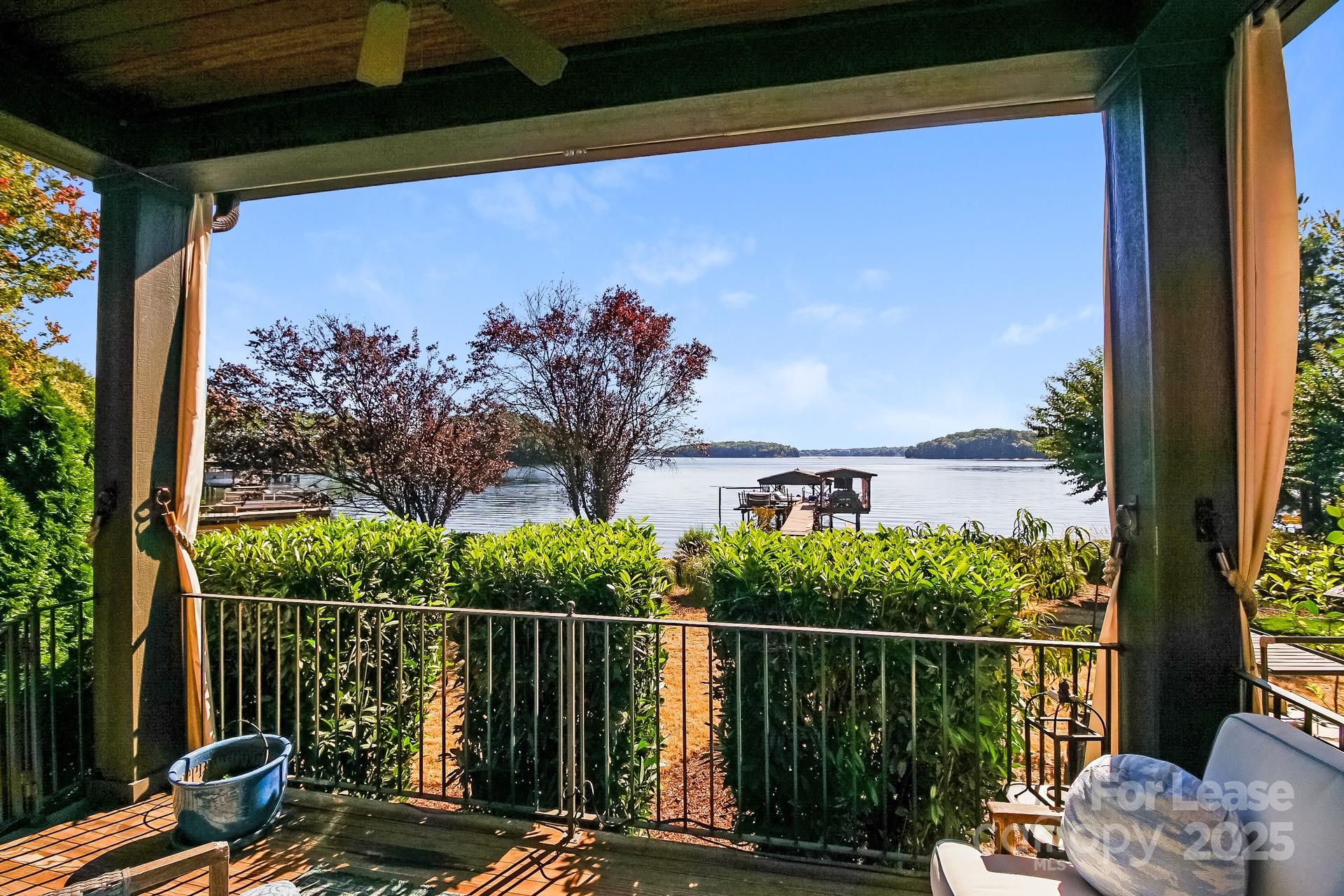 17120 Belle Isle Drive, Unit A Cornelius, NC 28031 - Photo 12 of 16 a view of a balcony with chair and table