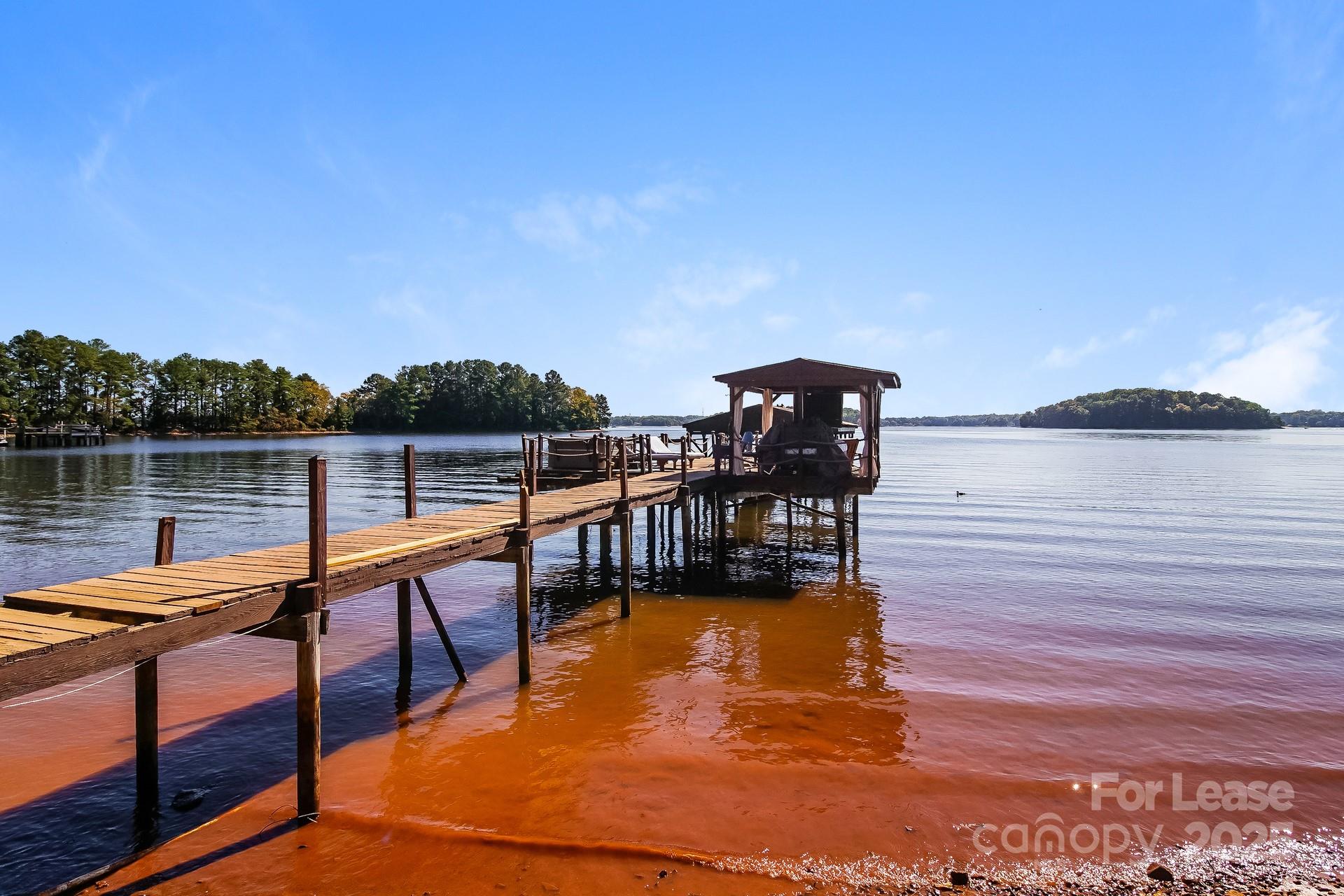 17120 Belle Isle Drive, Unit A Cornelius, NC 28031 - Photo 15 of 16 a view of a lake with outdoor seating