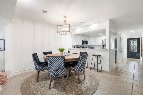 a view of a dining room with furniture