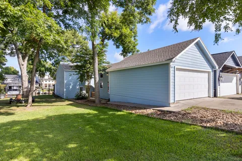a view of a backyard with a large tree