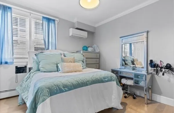 a bedroom with a bed and a table in it