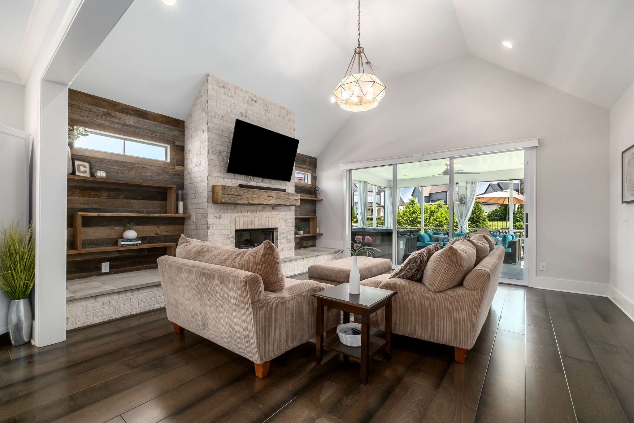 107 Vanner Road Mount Juliet, TN 37122 - Photo 14 of 54 a living room with furniture a flat screen tv and a fireplace
