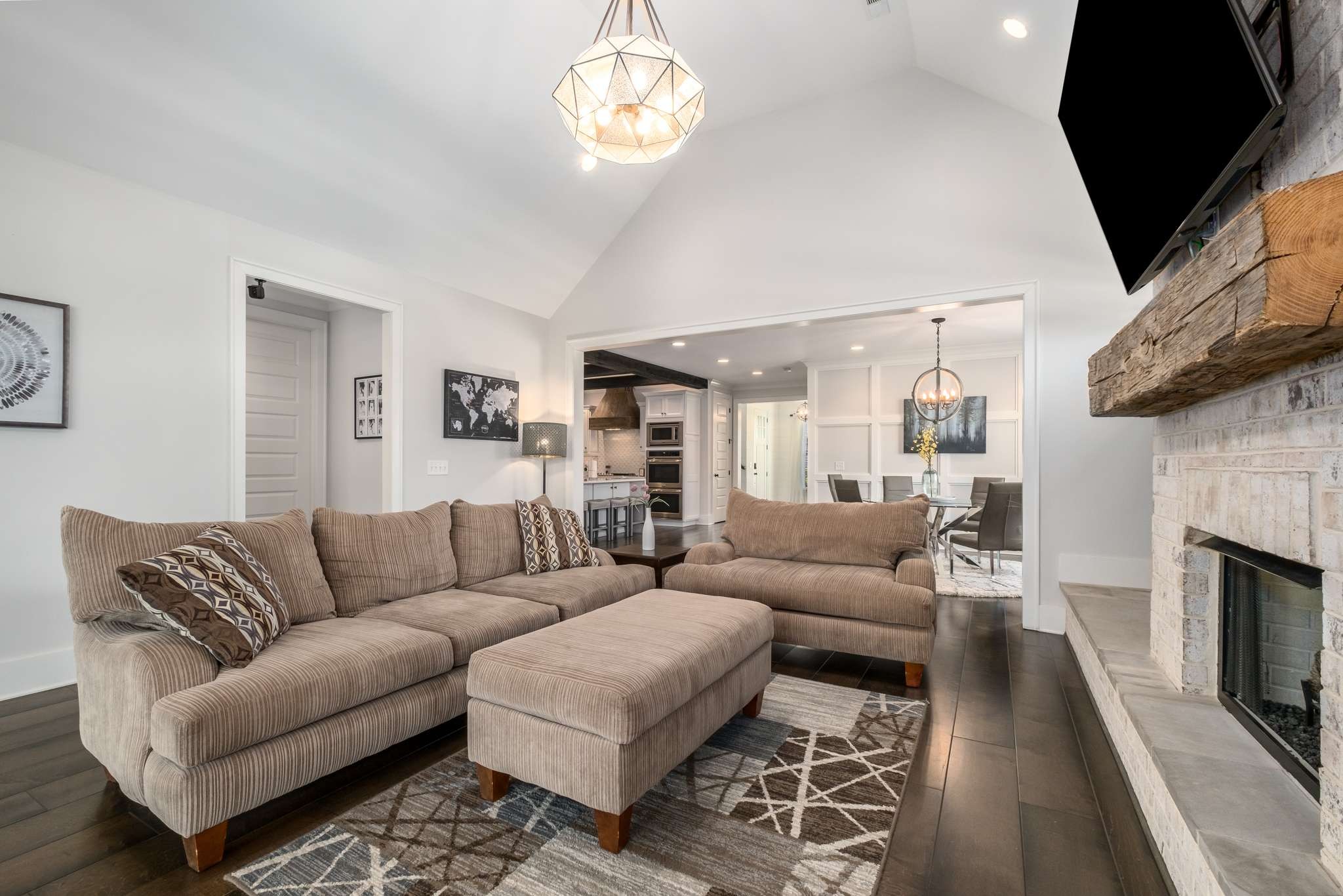 107 Vanner Road Mount Juliet, TN 37122 - Photo 16 of 54 a living room with furniture a fireplace and a flat screen tv