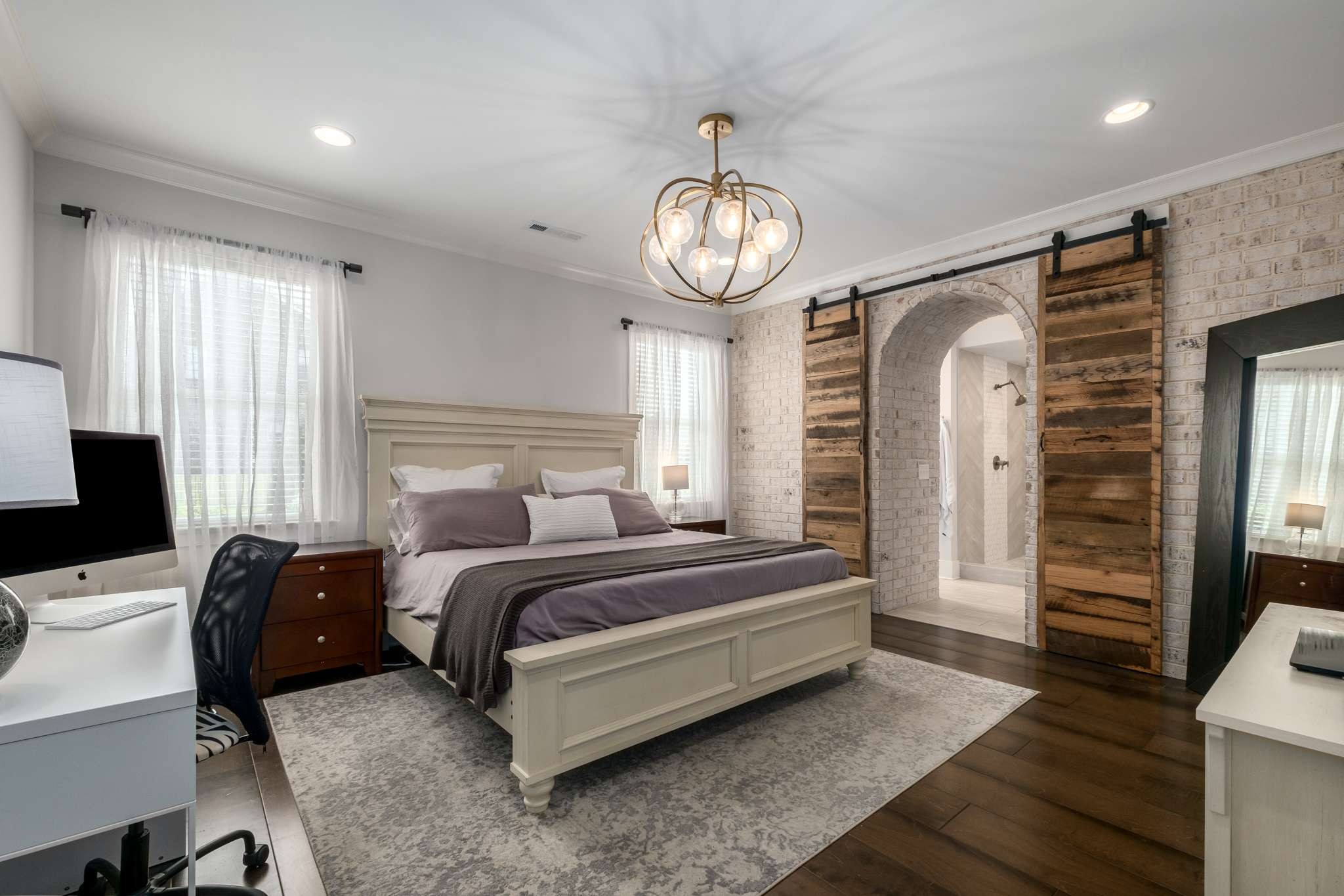 107 Vanner Road Mount Juliet, TN 37122 - Photo 17 of 54 a spacious bedroom with a bed mirror and a window