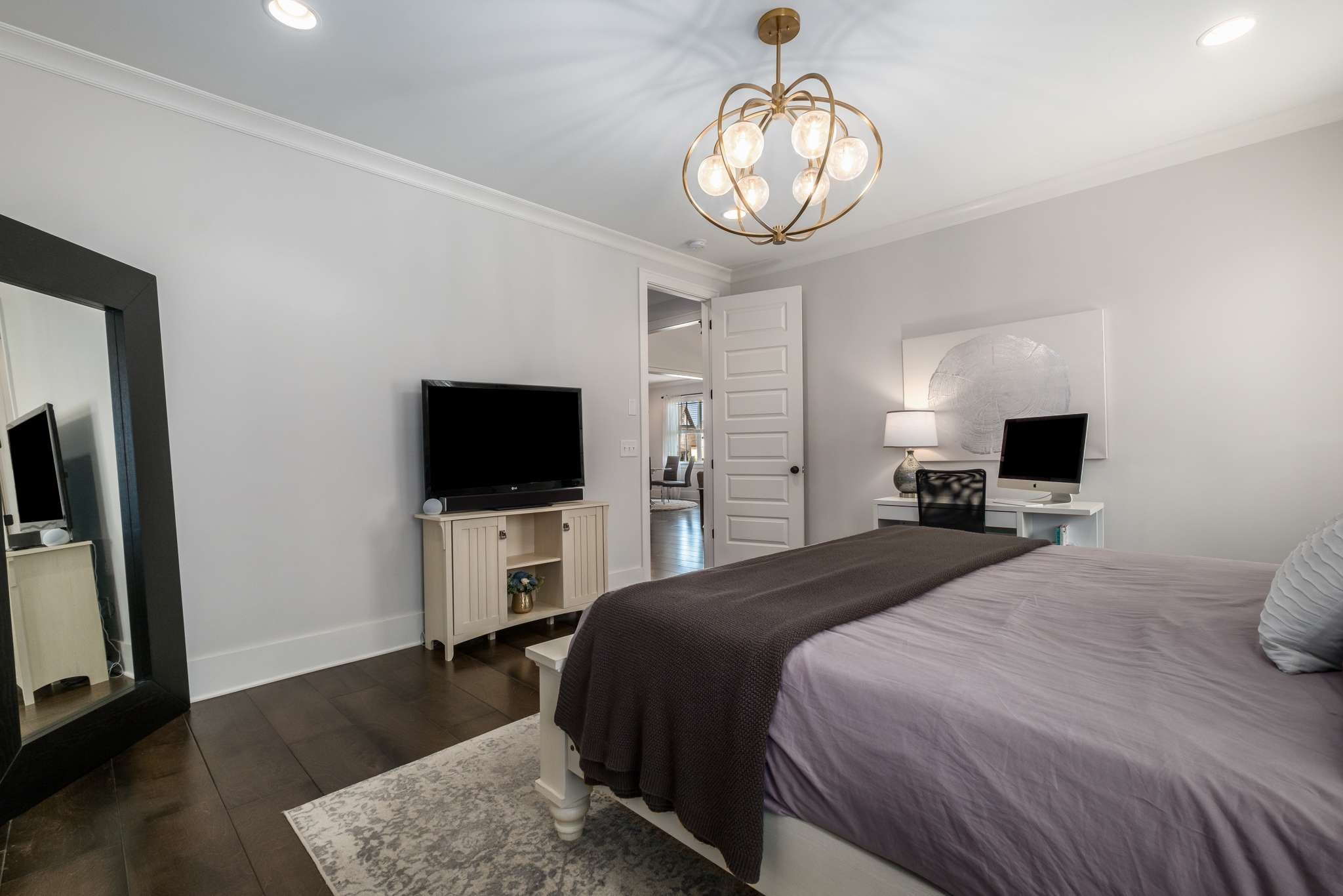 107 Vanner Road Mount Juliet, TN 37122 - Photo 18 of 54 a bedroom with a bed and a flat screen tv