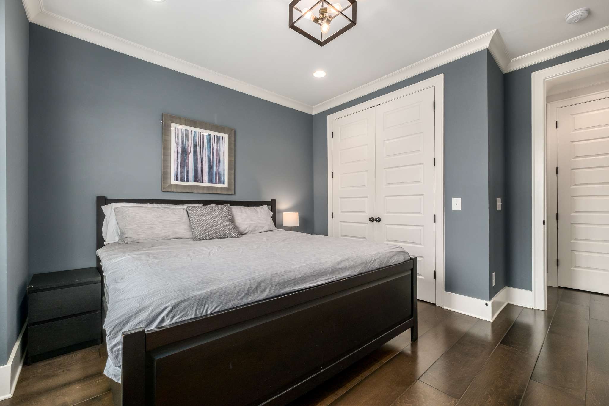 107 Vanner Road Mount Juliet, TN 37122 - Photo 23 of 54 a bedroom with a bed and wooden floor