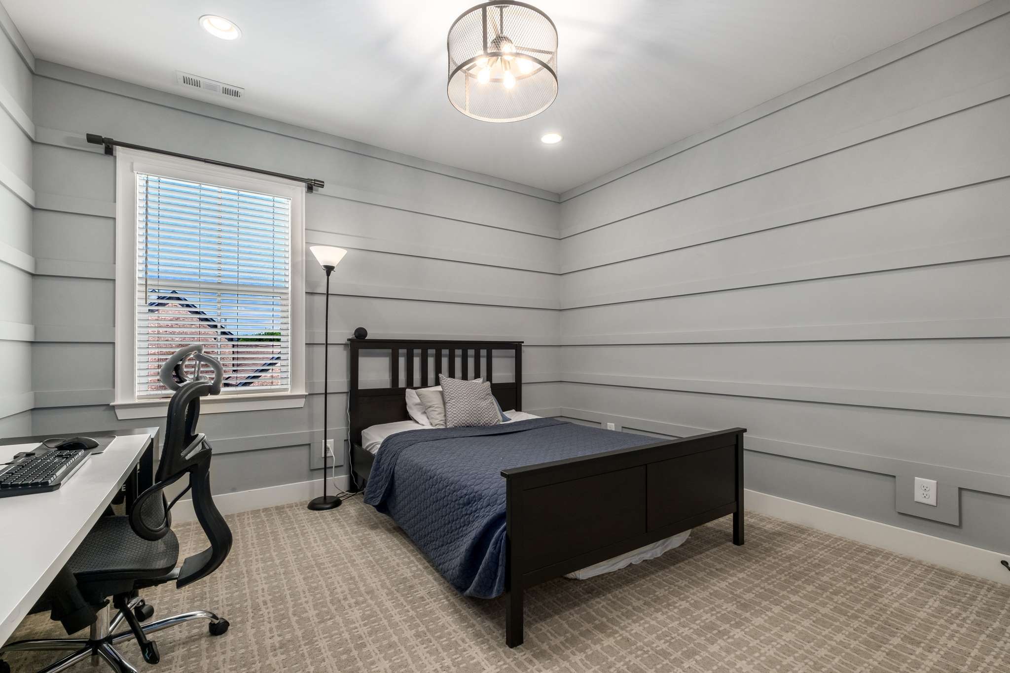 107 Vanner Road Mount Juliet, TN 37122 - Photo 31 of 54 a bedroom with a bed and a chandelier