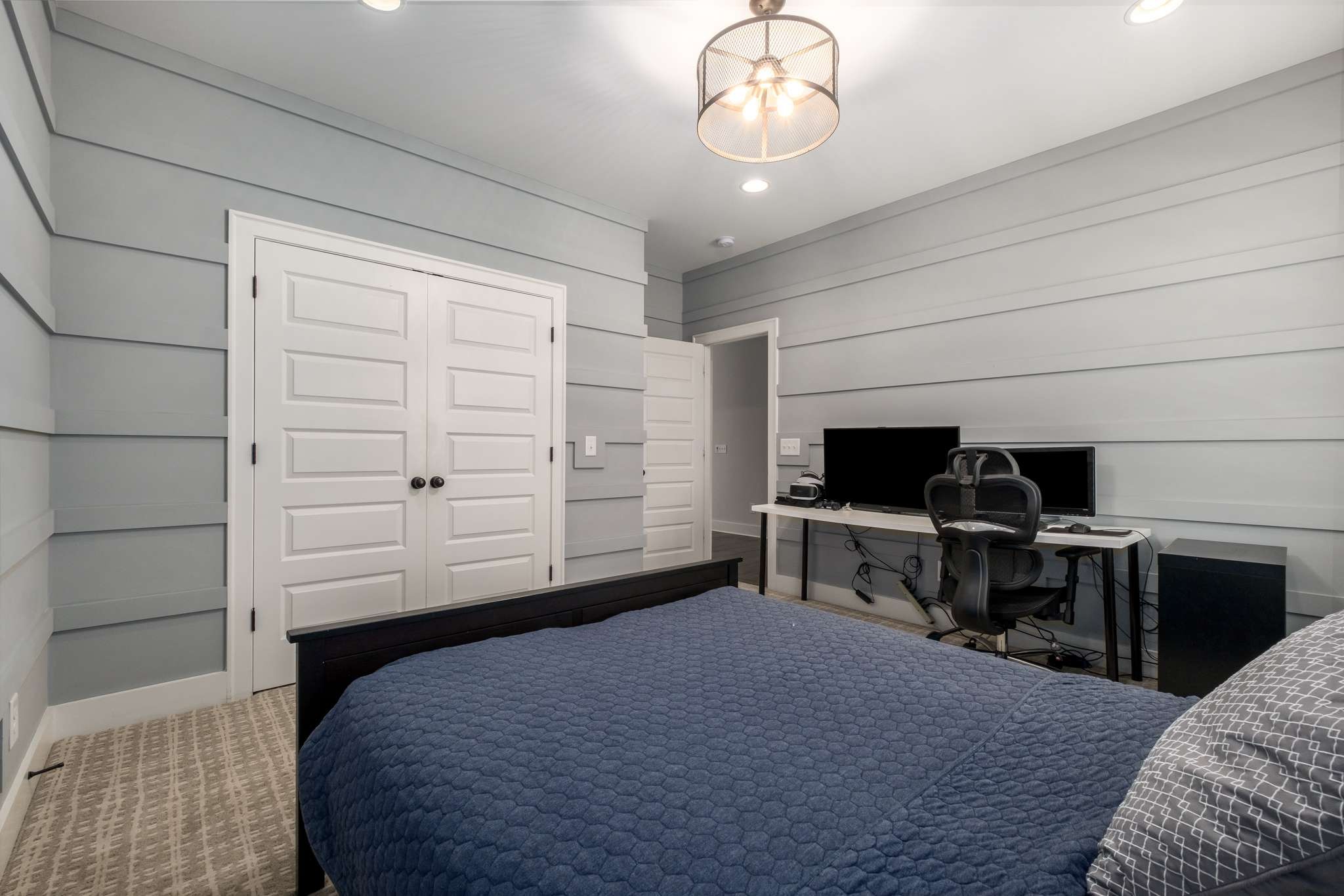 107 Vanner Road Mount Juliet, TN 37122 - Photo 32 of 54 a bedroom with a bed and a chandelier