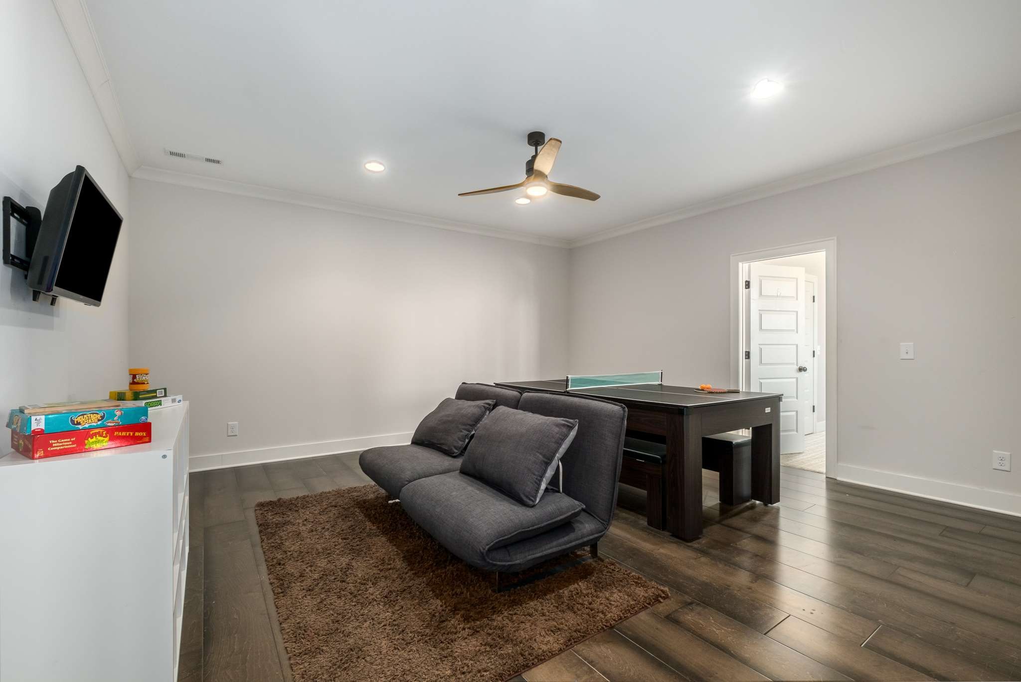 107 Vanner Road Mount Juliet, TN 37122 - Photo 36 of 54 a living room with furniture and a flat screen tv