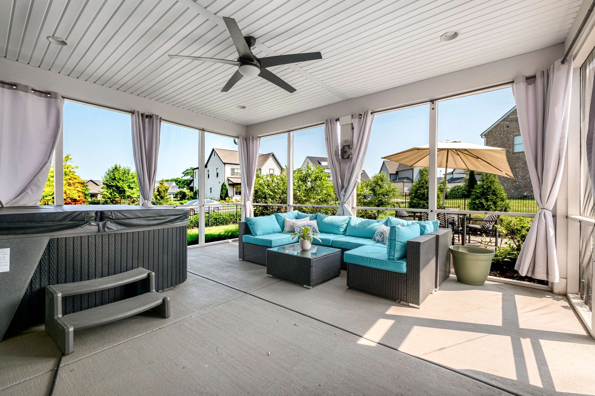 107 Vanner Road Mount Juliet, TN 37122 - Photo 38 of 54 a living room with patio furniture and a potted plant