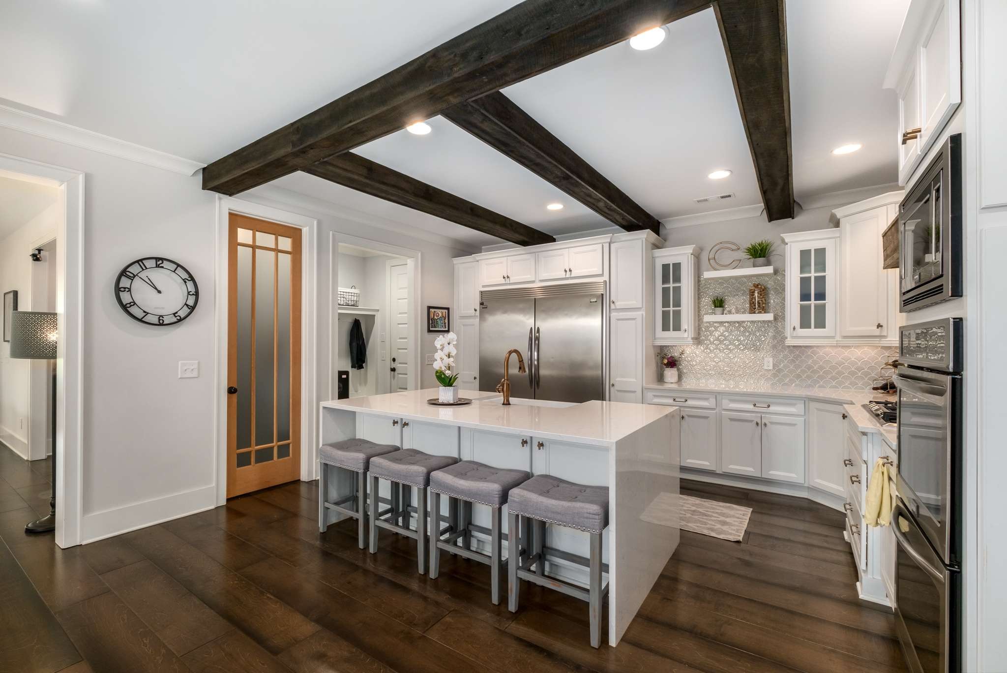 107 Vanner Road Mount Juliet, TN 37122 - Photo 7 of 54 a large kitchen with dining table and stainless steel appliances