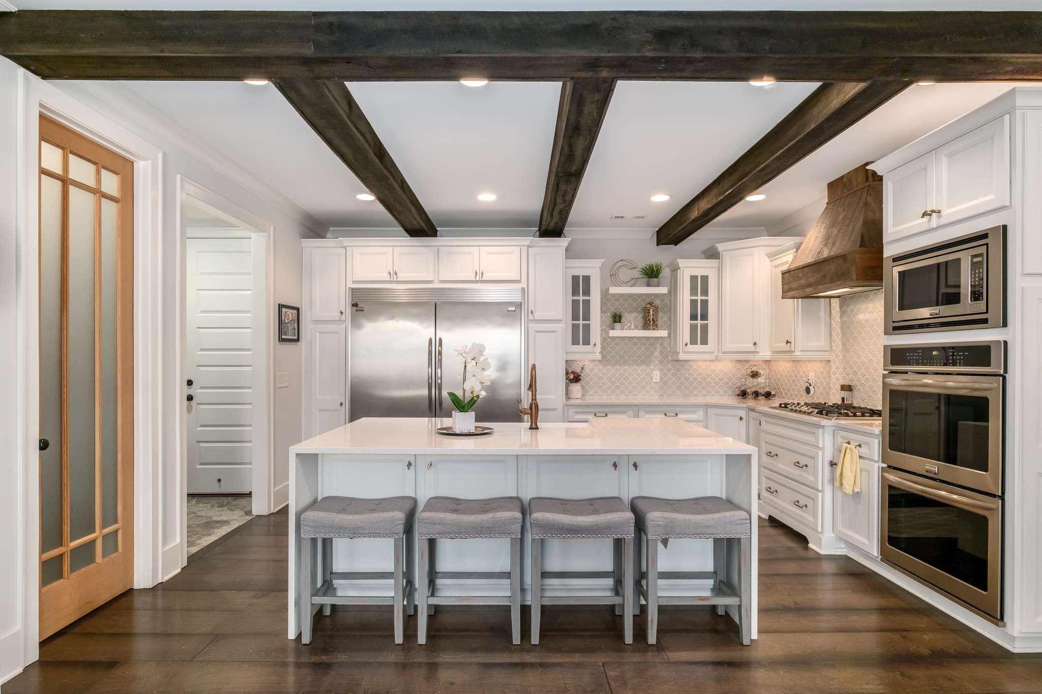 107 Vanner Road Mount Juliet, TN 37122 - Photo 8 of 54 a kitchen with a table chairs refrigerator and cabinets