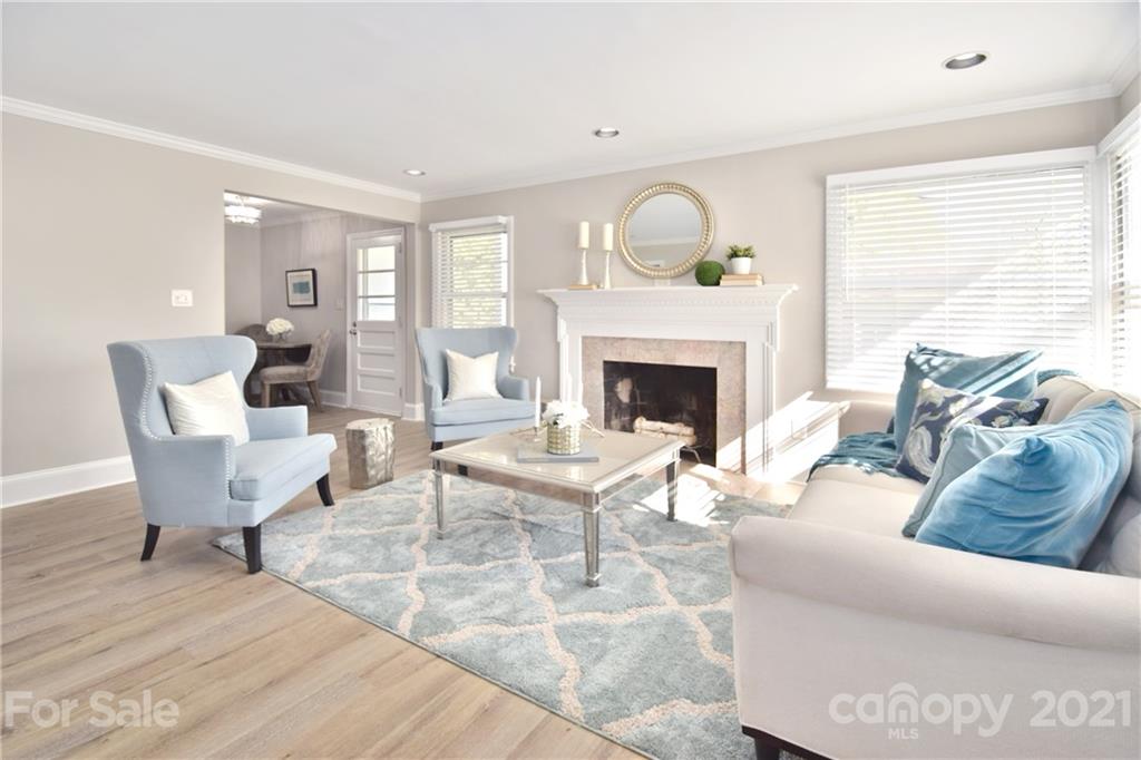 1727 Merry Oaks Road Charlotte, NC 28205 - Photo 2 of 20 a living room with furniture and a fireplace