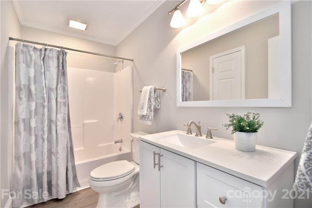 1727 Merry Oaks Road Charlotte, NC 28205 - Photo 11 of 20 a bathroom with a sink toilet and shower