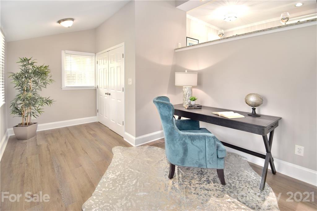 1727 Merry Oaks Road Charlotte, NC 28205 - Photo 14 of 20 a view of a dining room with furniture and wooden floor