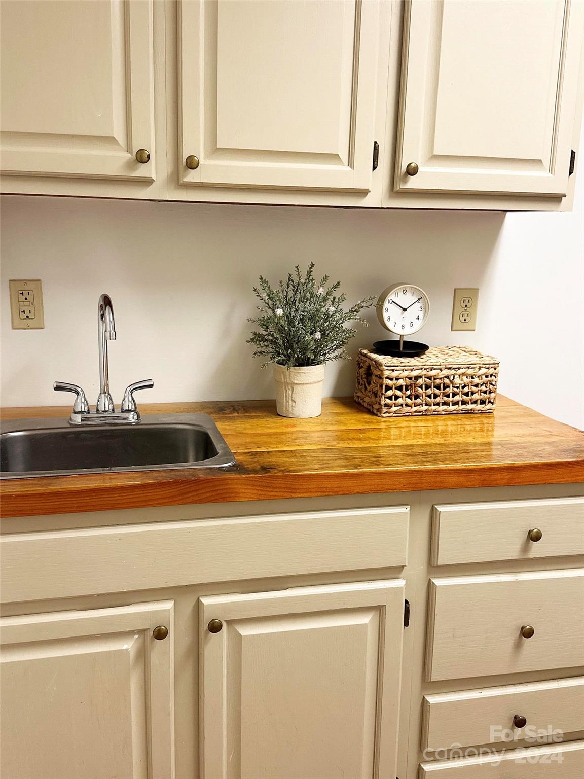 52 Sugar Loaf Road Sylva, NC 28779 - Photo 12 of 45 a kitchen with a sink and cabinets