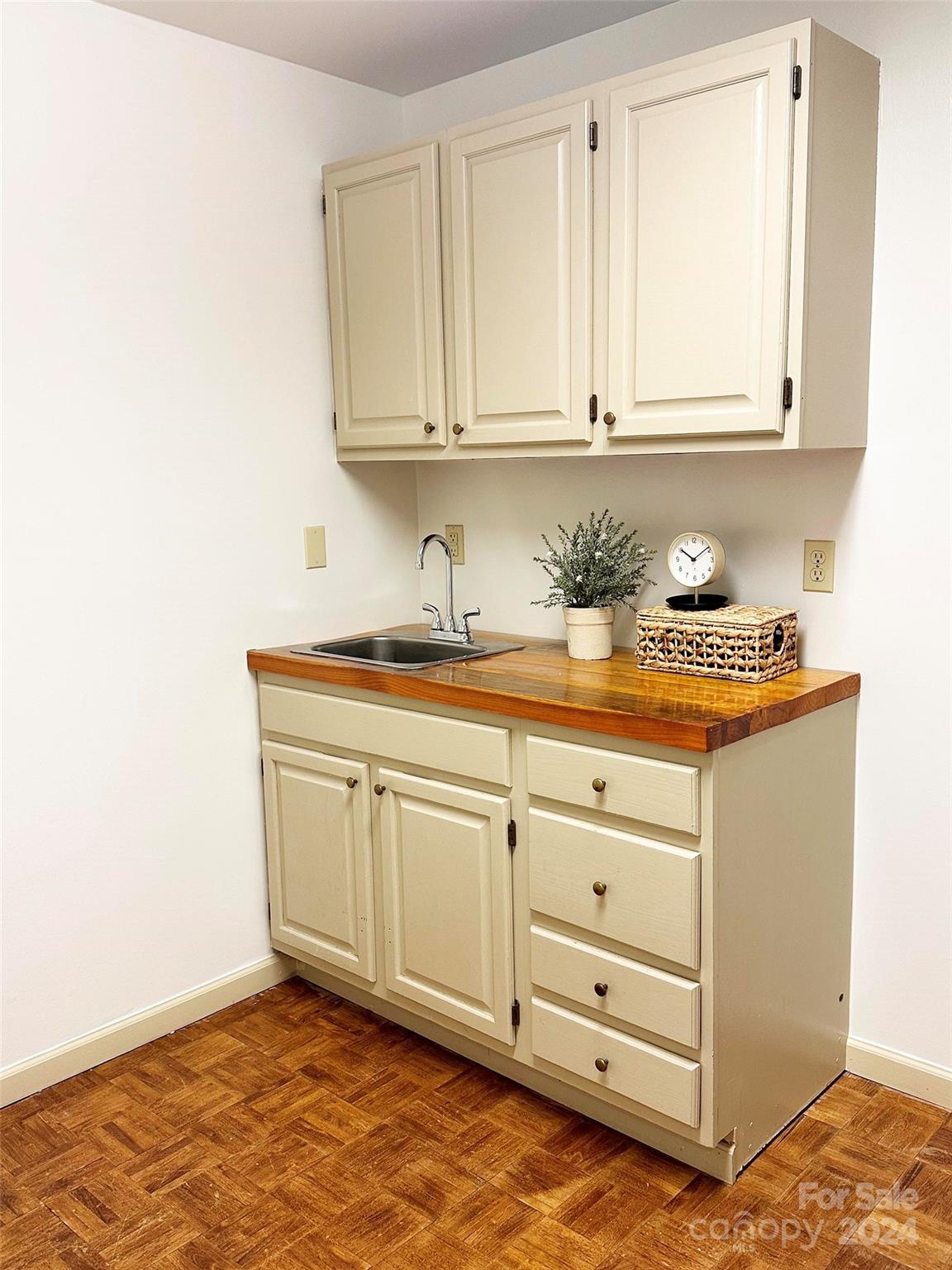 52 Sugar Loaf Road Sylva, NC 28779 - Photo 13 of 45 a kitchen with granite countertop white cabinets and white appliances