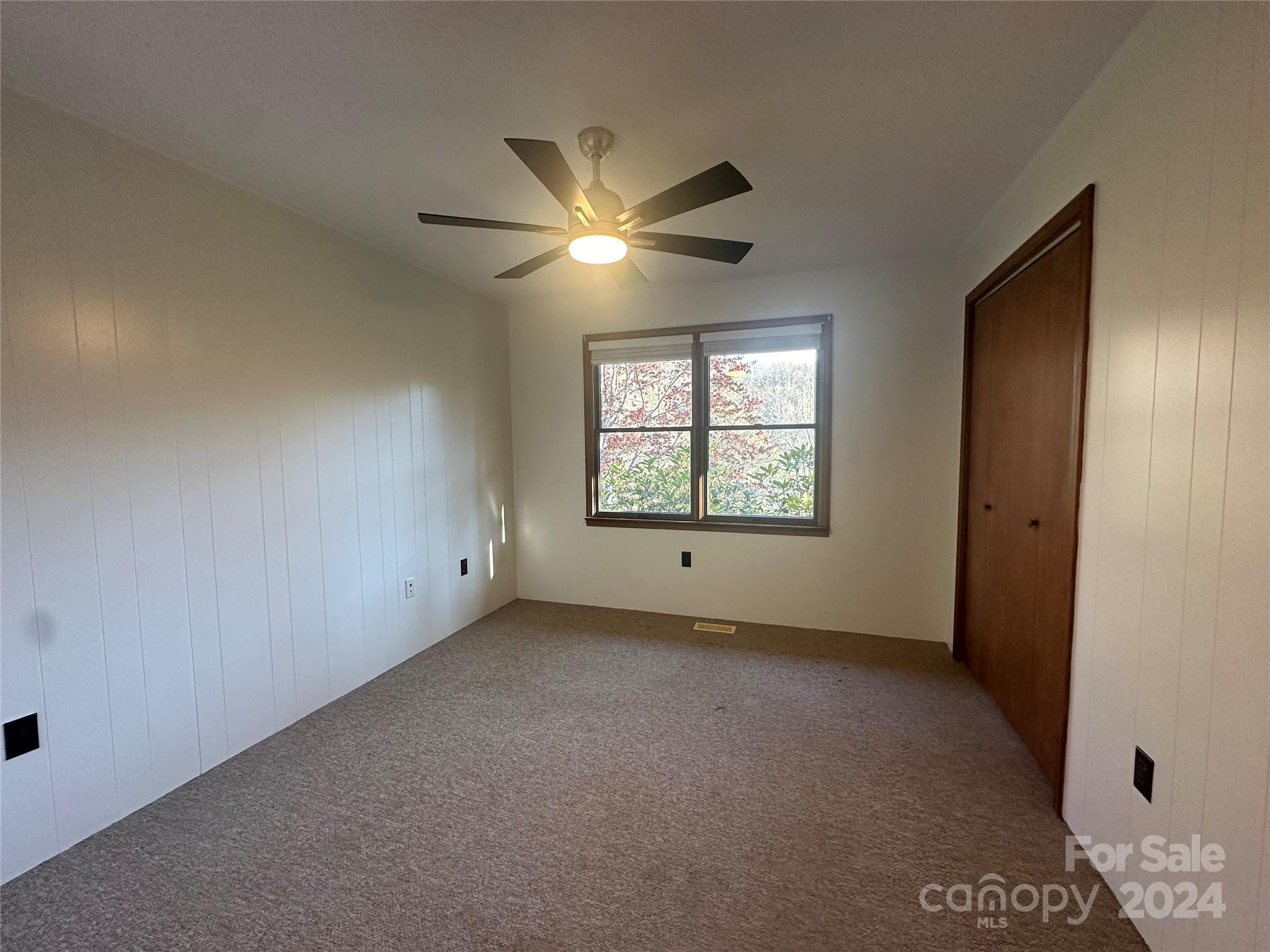 52 Sugar Loaf Road Sylva, NC 28779 - Photo 19 of 45 a view of an empty room with a window