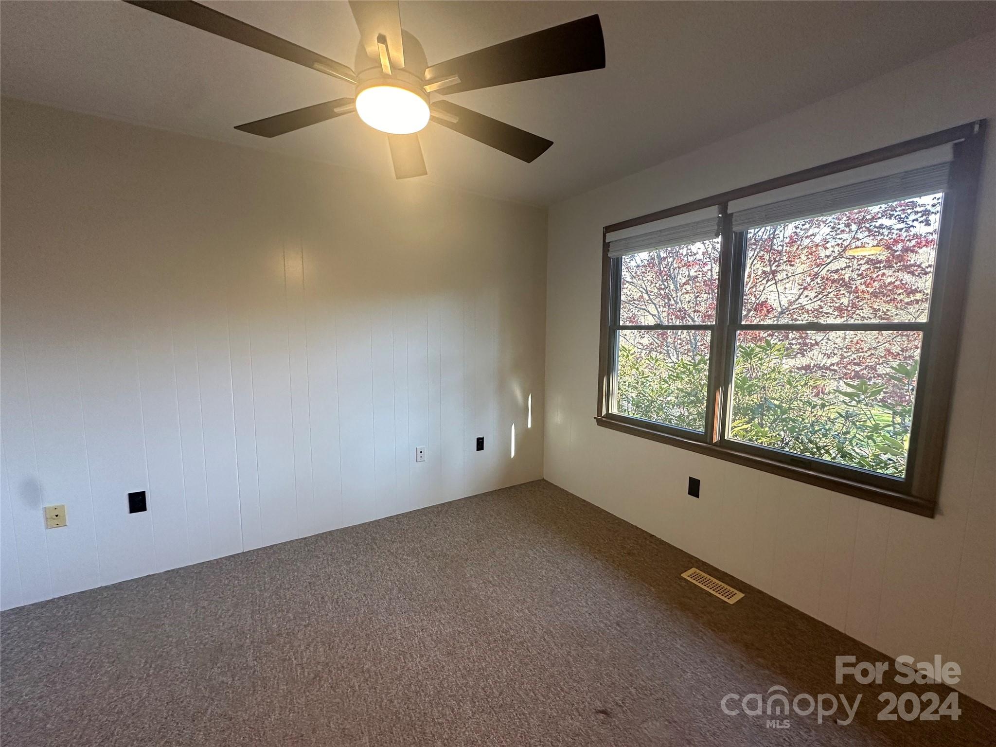52 Sugar Loaf Road Sylva, NC 28779 - Photo 20 of 45 a view of an empty room with a window