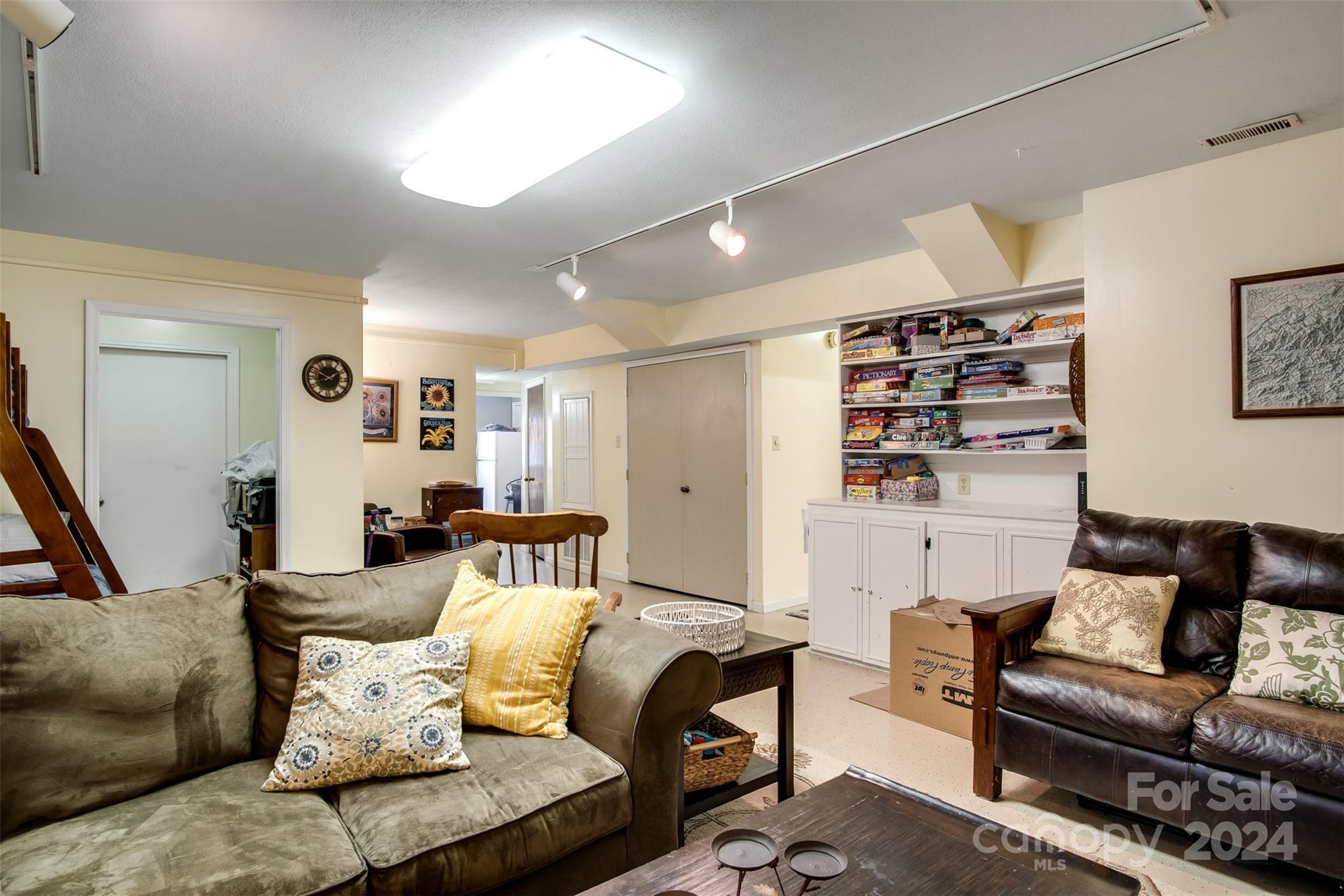 52 Sugar Loaf Road Sylva, NC 28779 - Photo 23 of 45 a living room with furniture and a couch