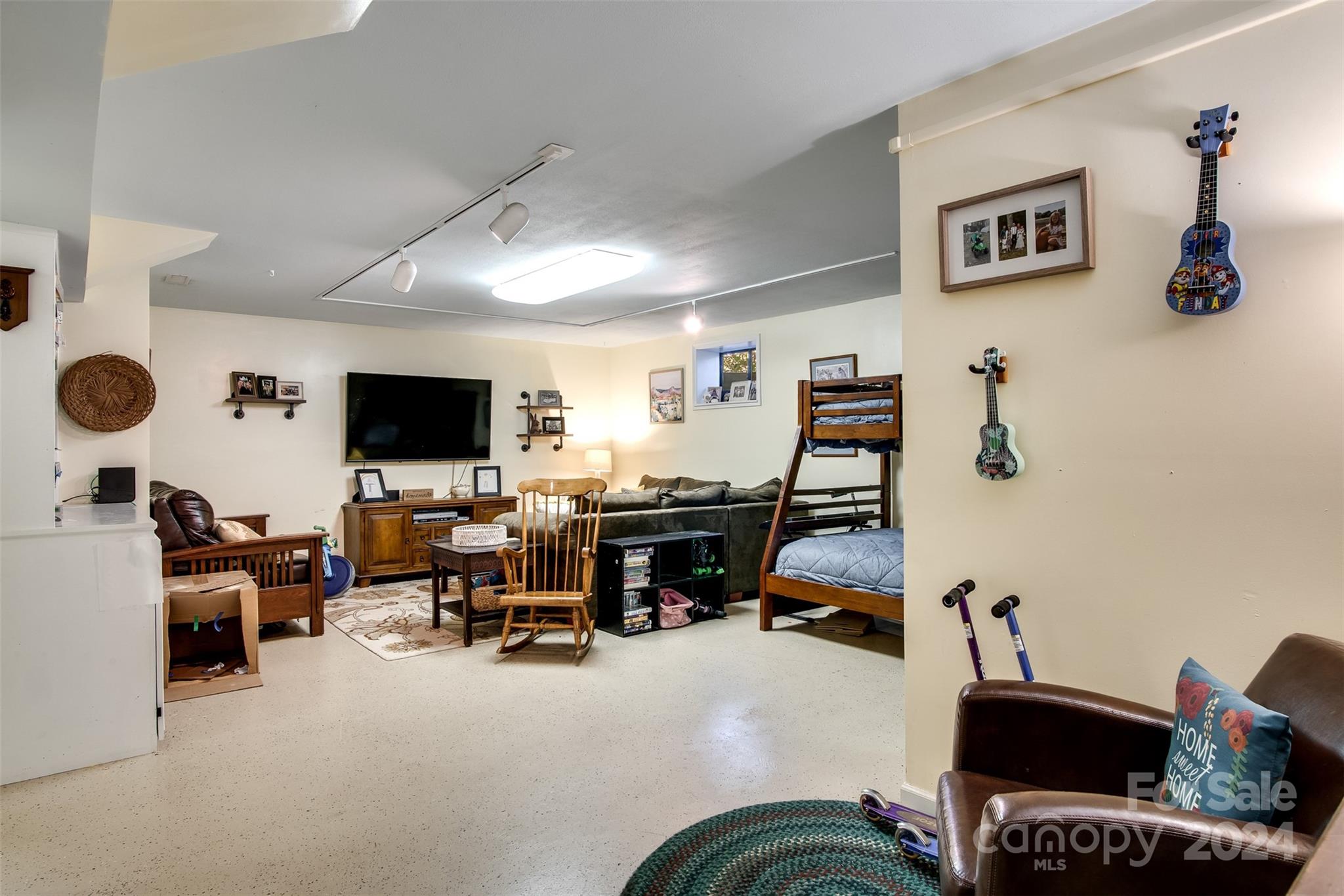 52 Sugar Loaf Road Sylva, NC 28779 - Photo 24 of 45 a living room with furniture and a flat screen tv