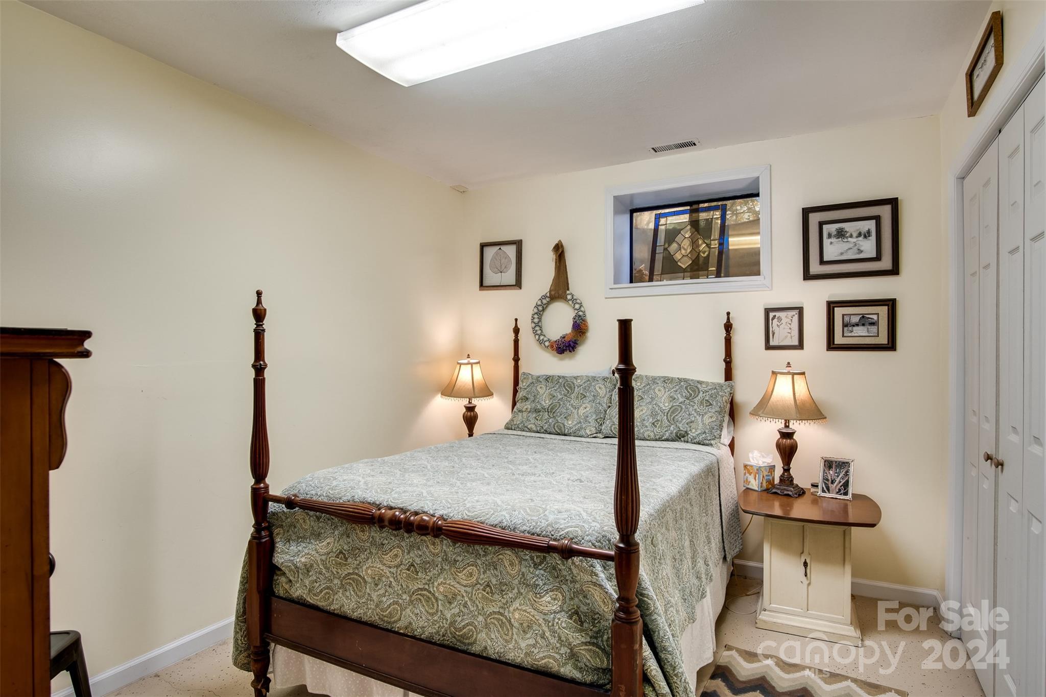52 Sugar Loaf Road Sylva, NC 28779 - Photo 27 of 45 a bedroom with a bed and wooden floor