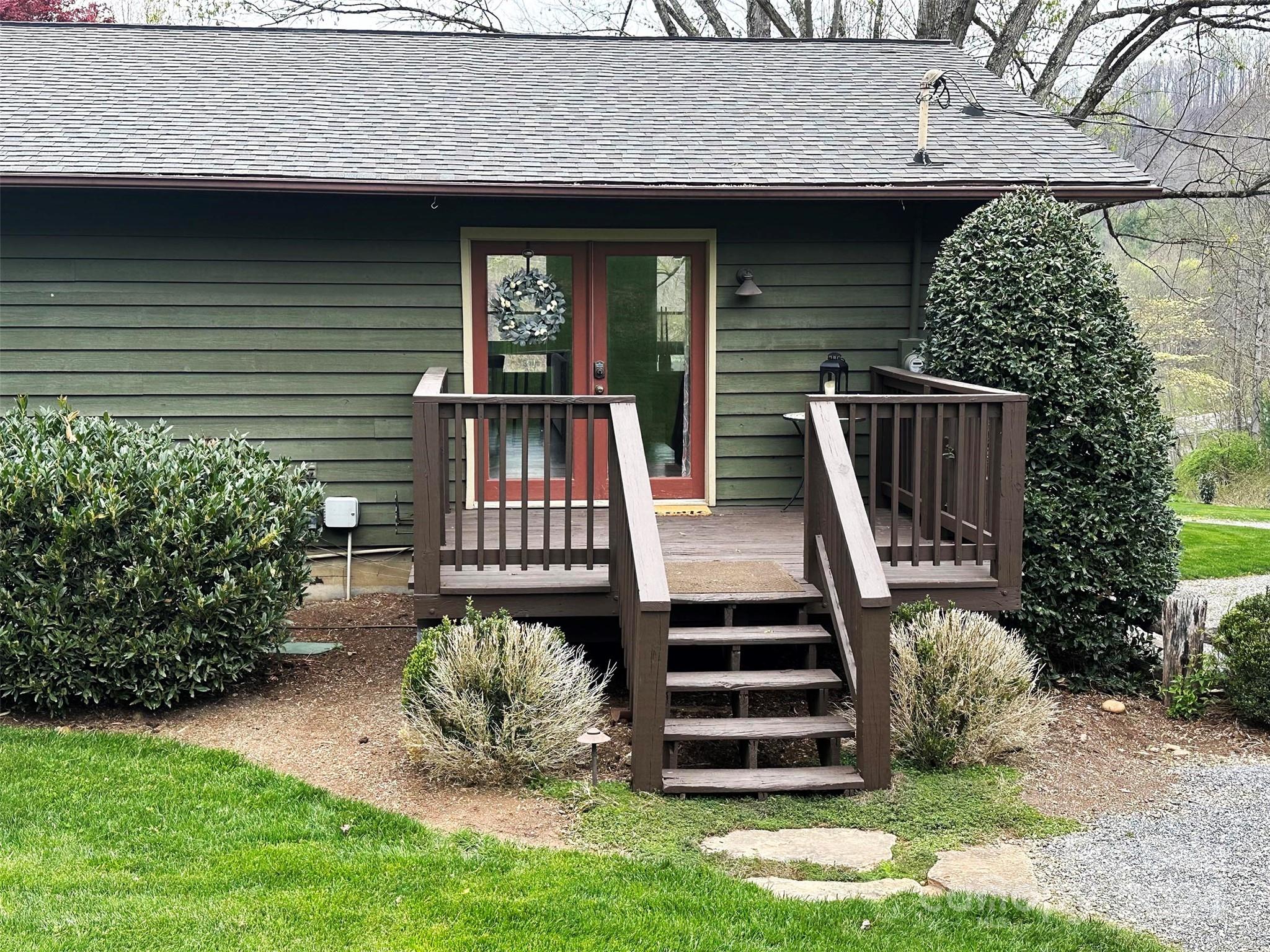 52 Sugar Loaf Road Sylva, NC 28779 - Photo 31 of 45 a front view of a house with garden