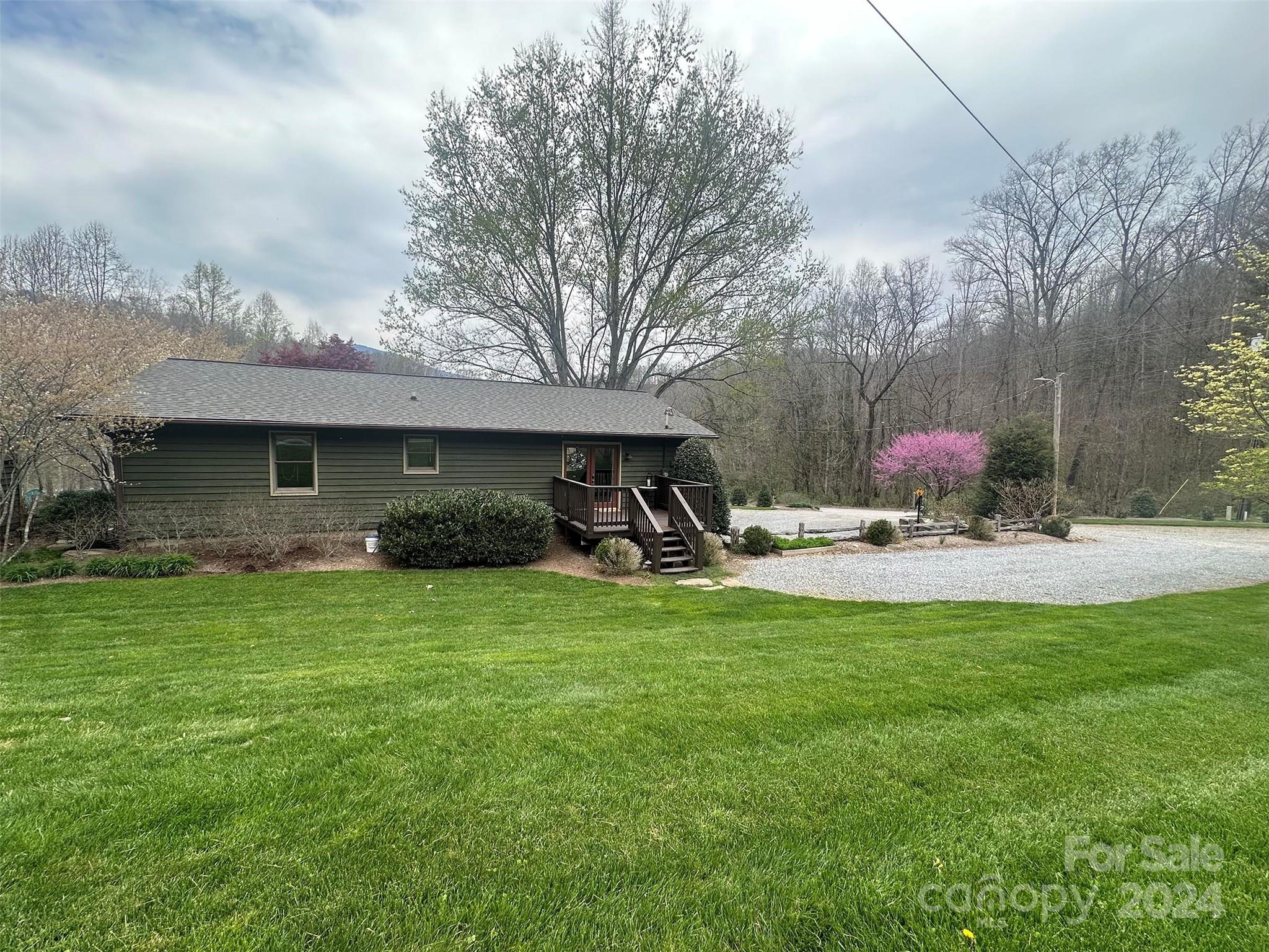 52 Sugar Loaf Road Sylva, NC 28779 - Photo 33 of 45 a view of a house with backyard and sitting area