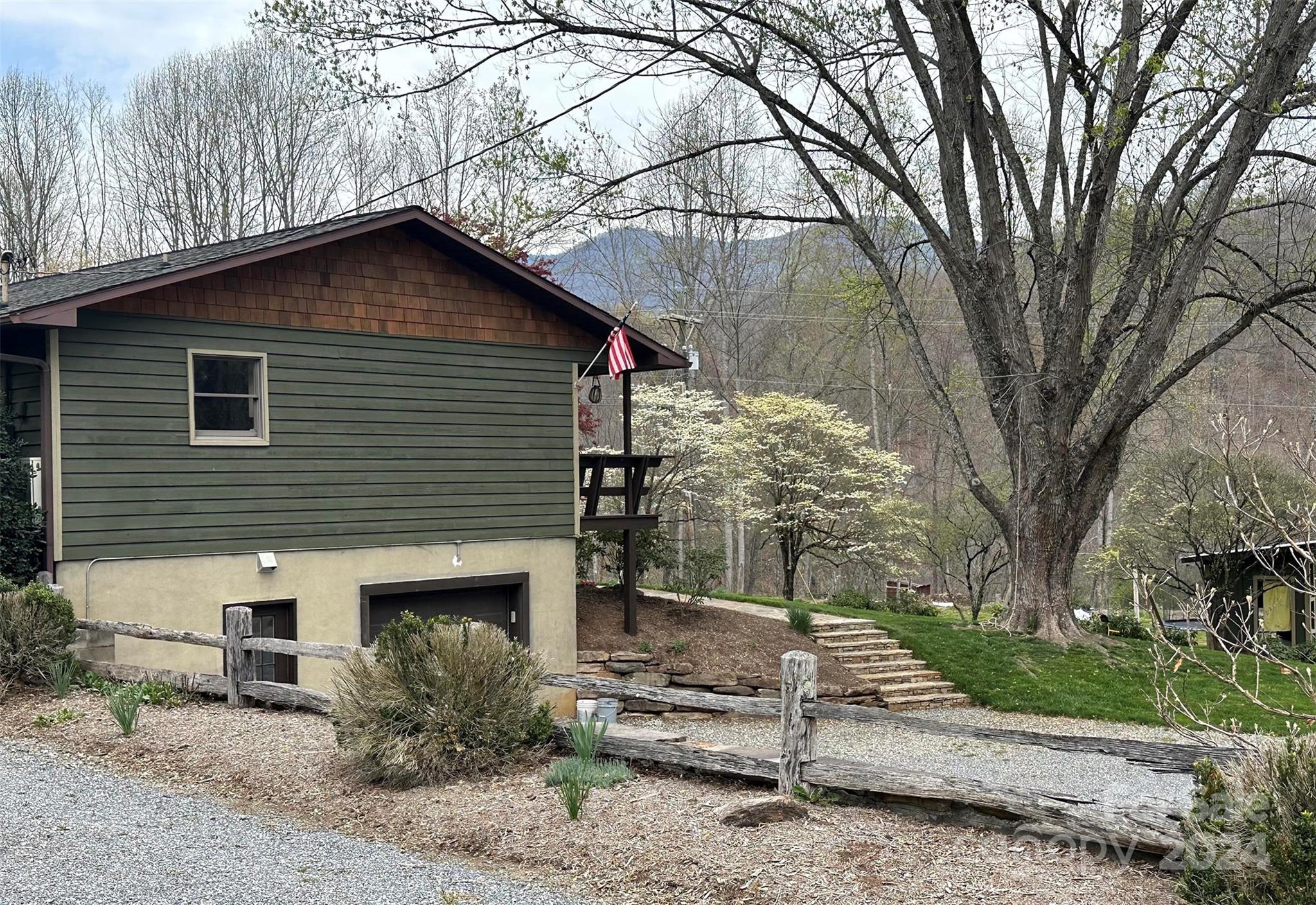 52 Sugar Loaf Road Sylva, NC 28779 - Photo 35 of 45 a house that has a tree in front of the house