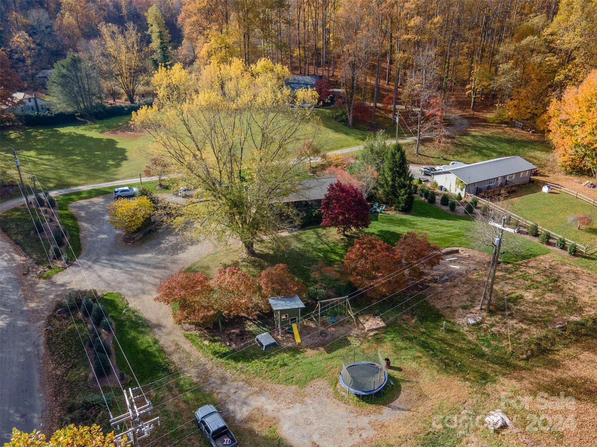 52 Sugar Loaf Road Sylva, NC 28779 - Photo 43 of 45 a view of a garden with lawn chairs