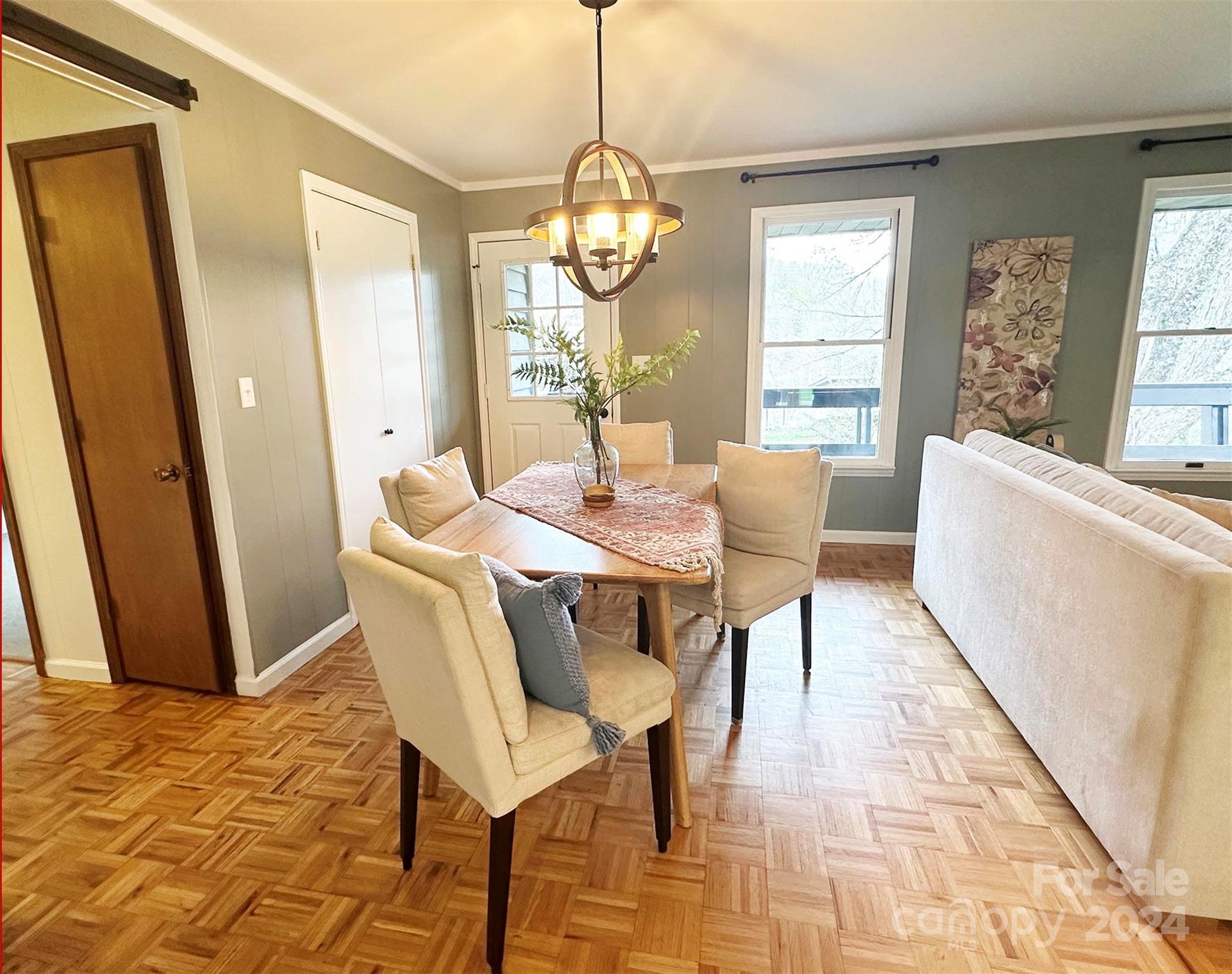 52 Sugar Loaf Road Sylva, NC 28779 - Photo 5 of 45 a view of a dining room with furniture window and wooden floor