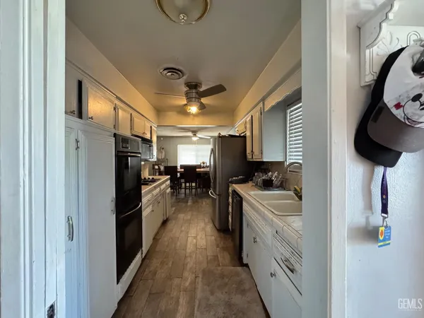 a kitchen with stainless steel appliances a refrigerator and a sink