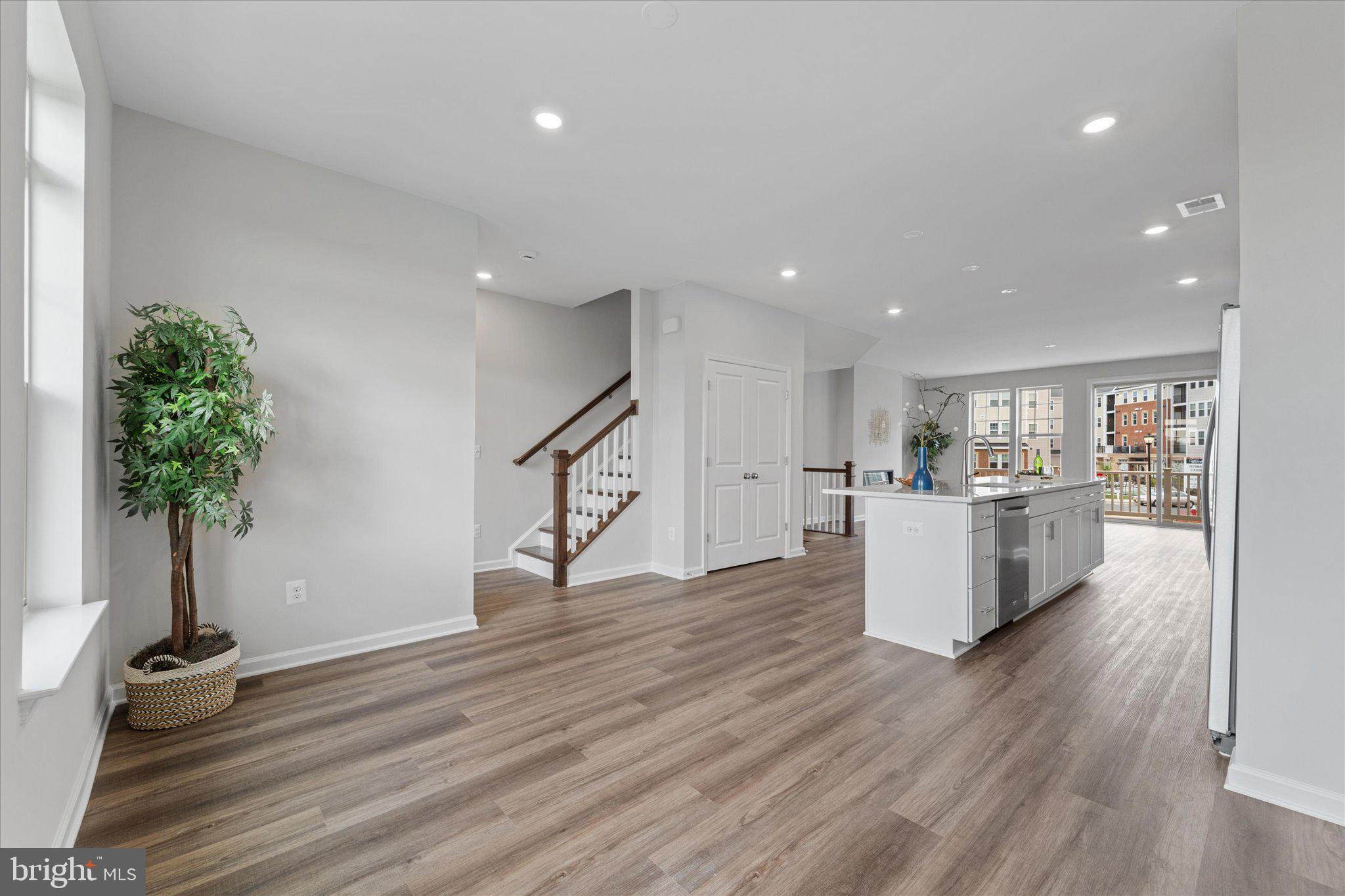 705 Sawback Square Northeast Leesburg, VA 20176 - Photo 12 of 38 a view of kitchen with furniture and wooden floor