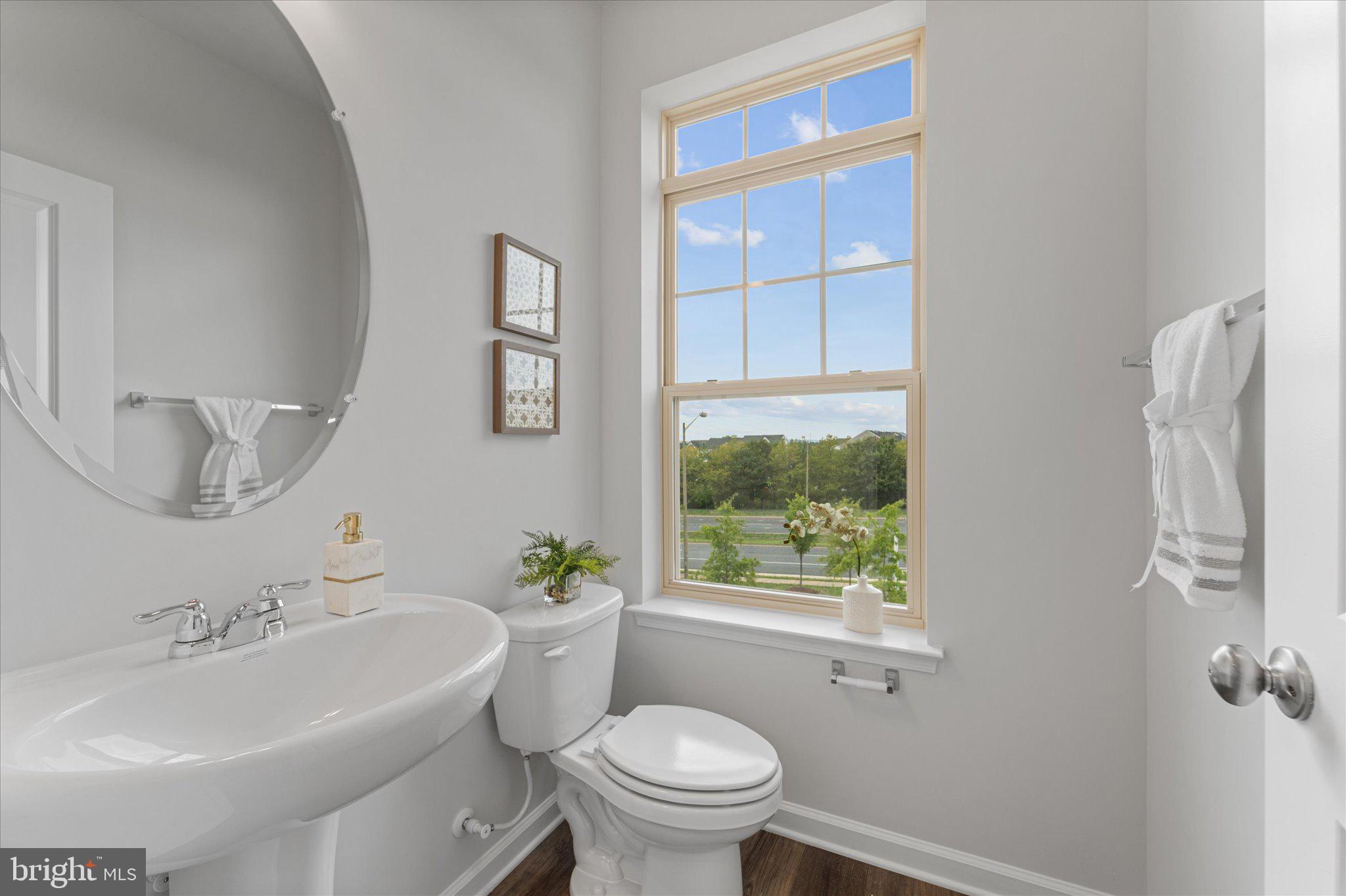 705 Sawback Square Northeast Leesburg, VA 20176 - Photo 16 of 38 a bathroom with a sink toilet and a mirror