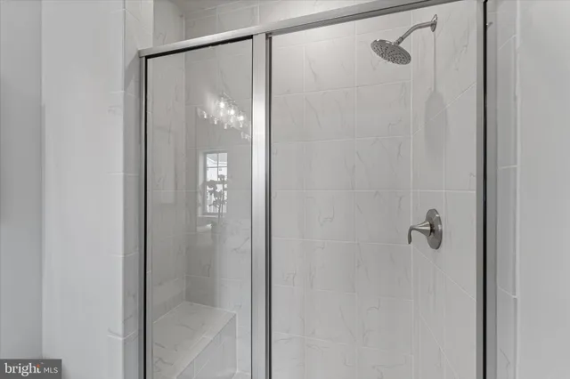 a bathroom that has a glass shower door