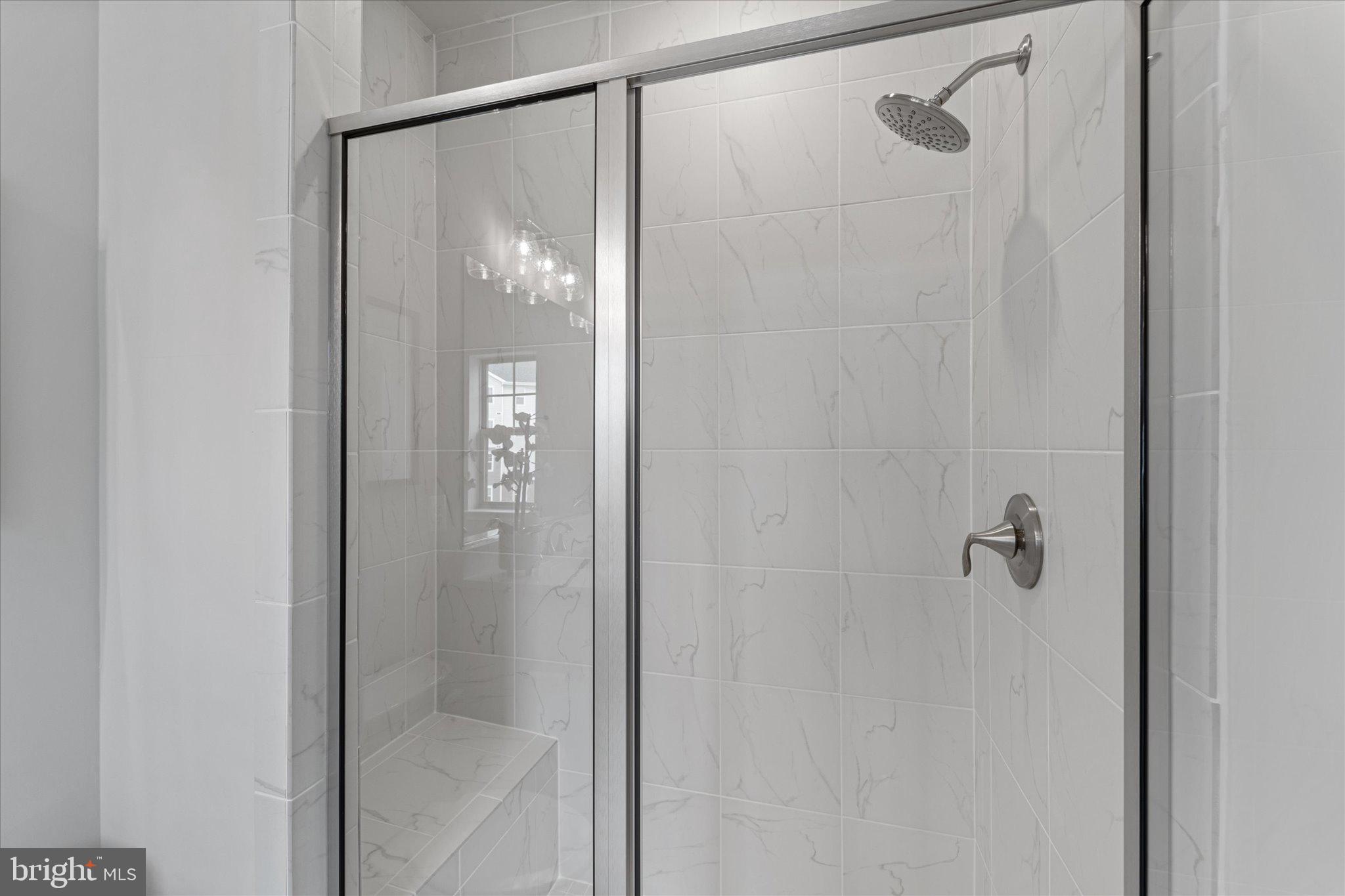 705 Sawback Square Northeast Leesburg, VA 20176 - Photo 23 of 38 a bathroom that has a glass shower door