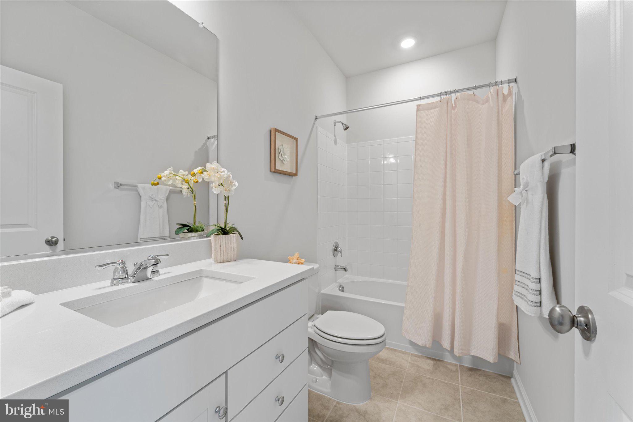 705 Sawback Square Northeast Leesburg, VA 20176 - Photo 27 of 38 a bathroom with a sink a toilet and shower