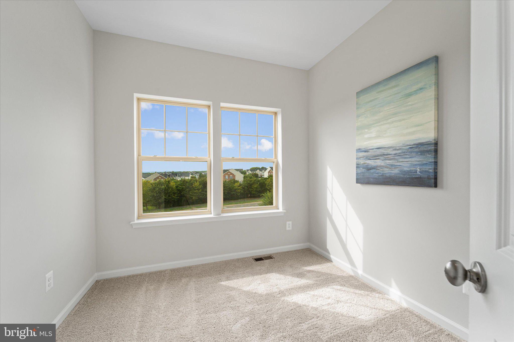 705 Sawback Square Northeast Leesburg, VA 20176 - Photo 28 of 38 a view of an empty room with a window