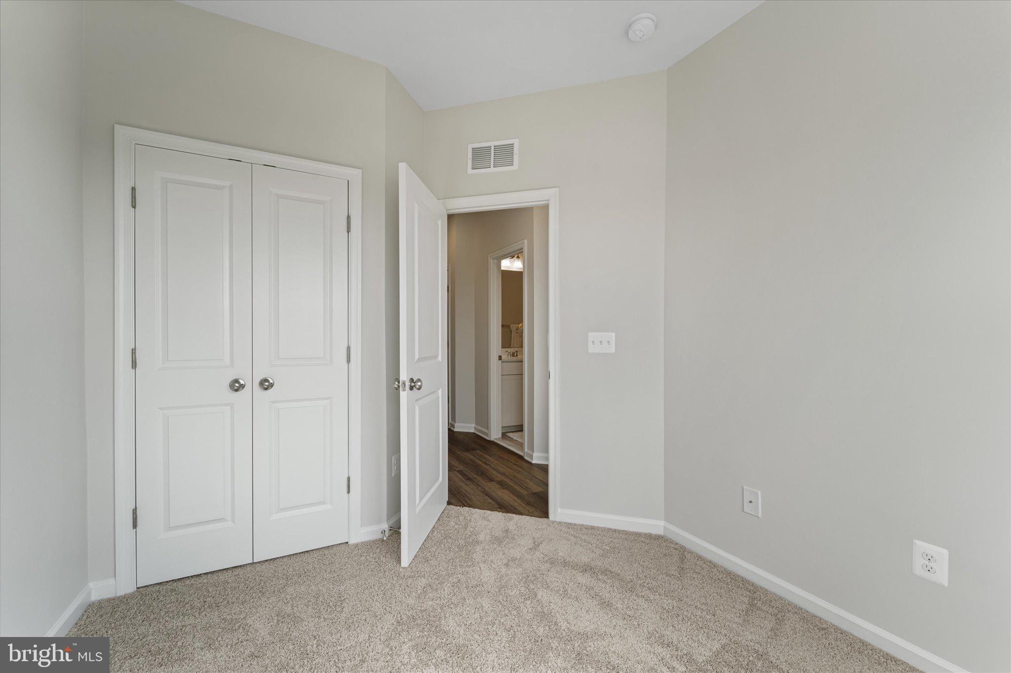 705 Sawback Square Northeast Leesburg, VA 20176 - Photo 29 of 38 a view of an empty room with closet and mirror