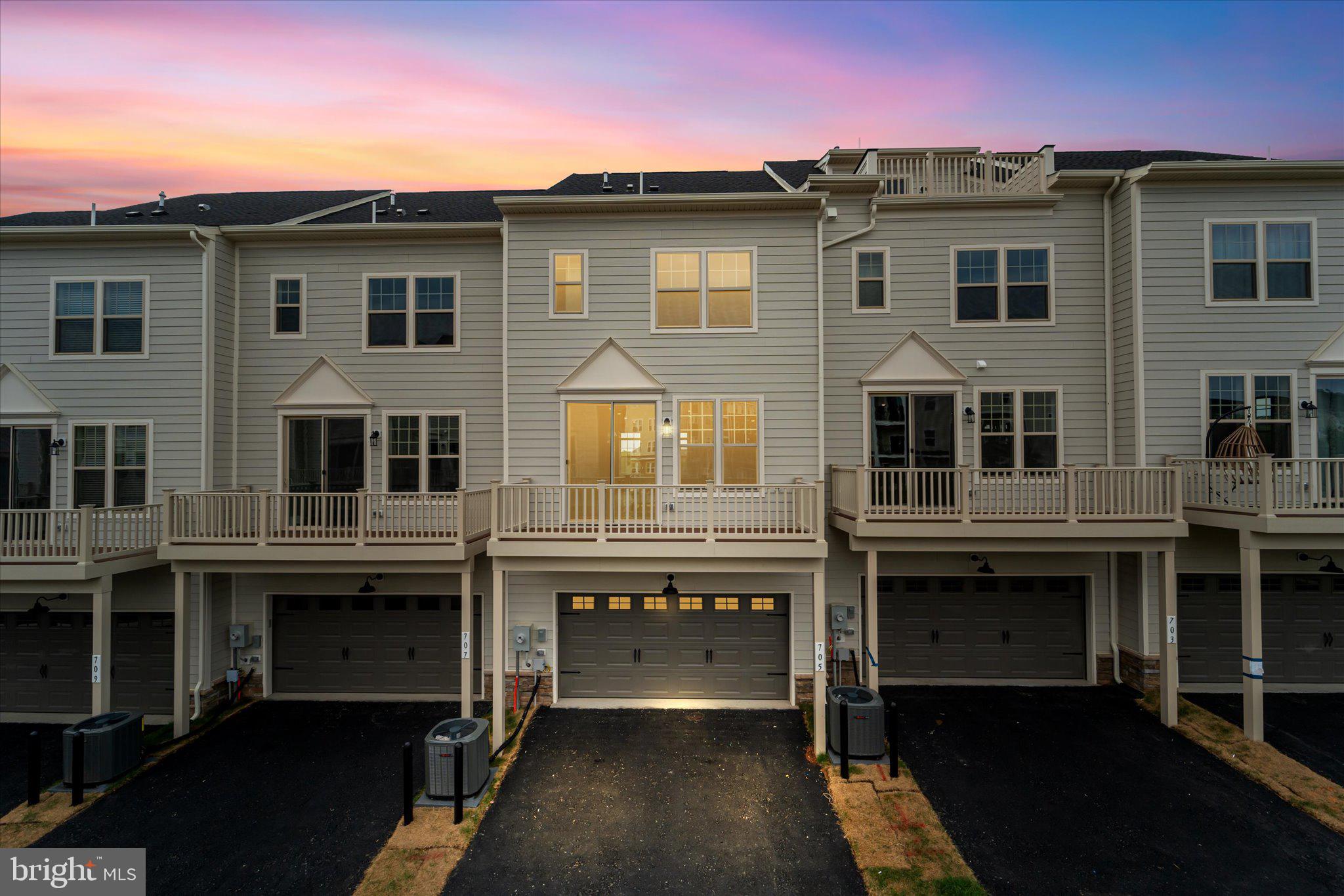 705 Sawback Square Northeast Leesburg, VA 20176 - Photo 30 of 38 a front view of a house with a balcony